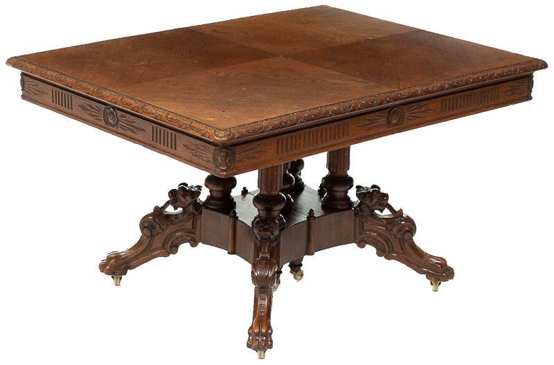 Eastlake-Style Pedestal Dining Table: Eastlake-style pedestal carved dining table, dragon motif legs, claw feet on casters 30.5"h x 52.5"w x 41"d State-wide delivery is available for this item. Please email shipping@vogtauction.com or cal
