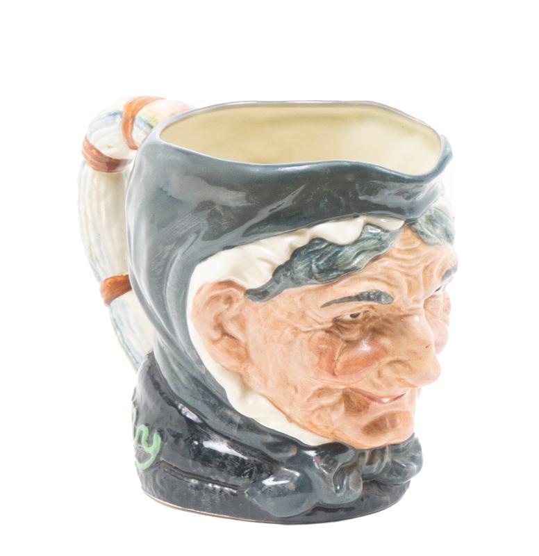 Royal Doulton Staffordshire Toby Jug: Royal Doulton English Staffordshire ceramic toby jug in the shape of an old maid, gra, with handle 6.5"h x 4.5"d â€‹â€‹â€‹â€‹â€‹â€‹â€‹Provenance: The Estate of Mary