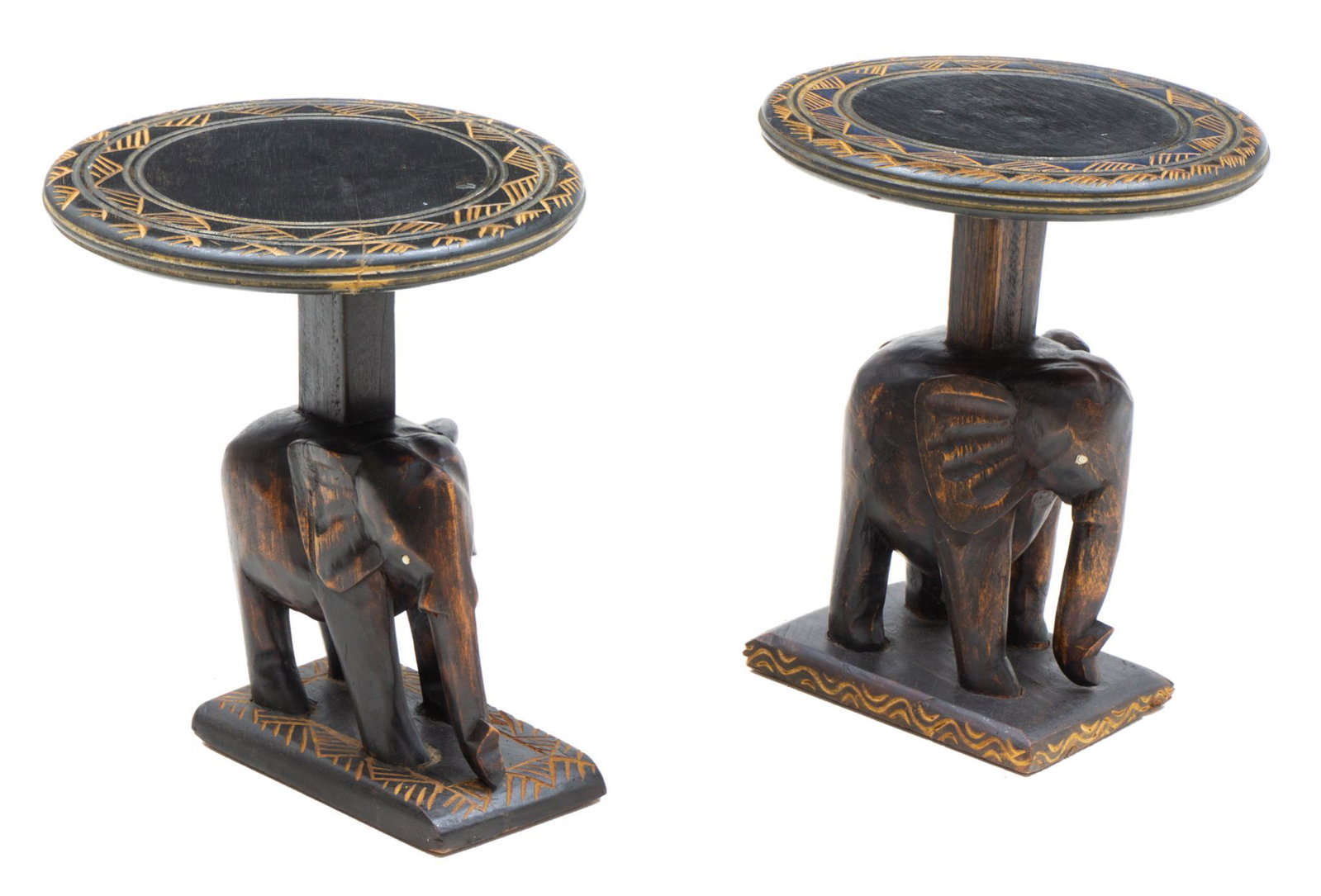 Pair of Carved Elephant Occasional Tables: Pair of African-style carved occasional tables, carved elephant base with gold painted floral motif on circular top 14"h x 11.5"d/ each In-house shipping and delivery is available on this item. Please