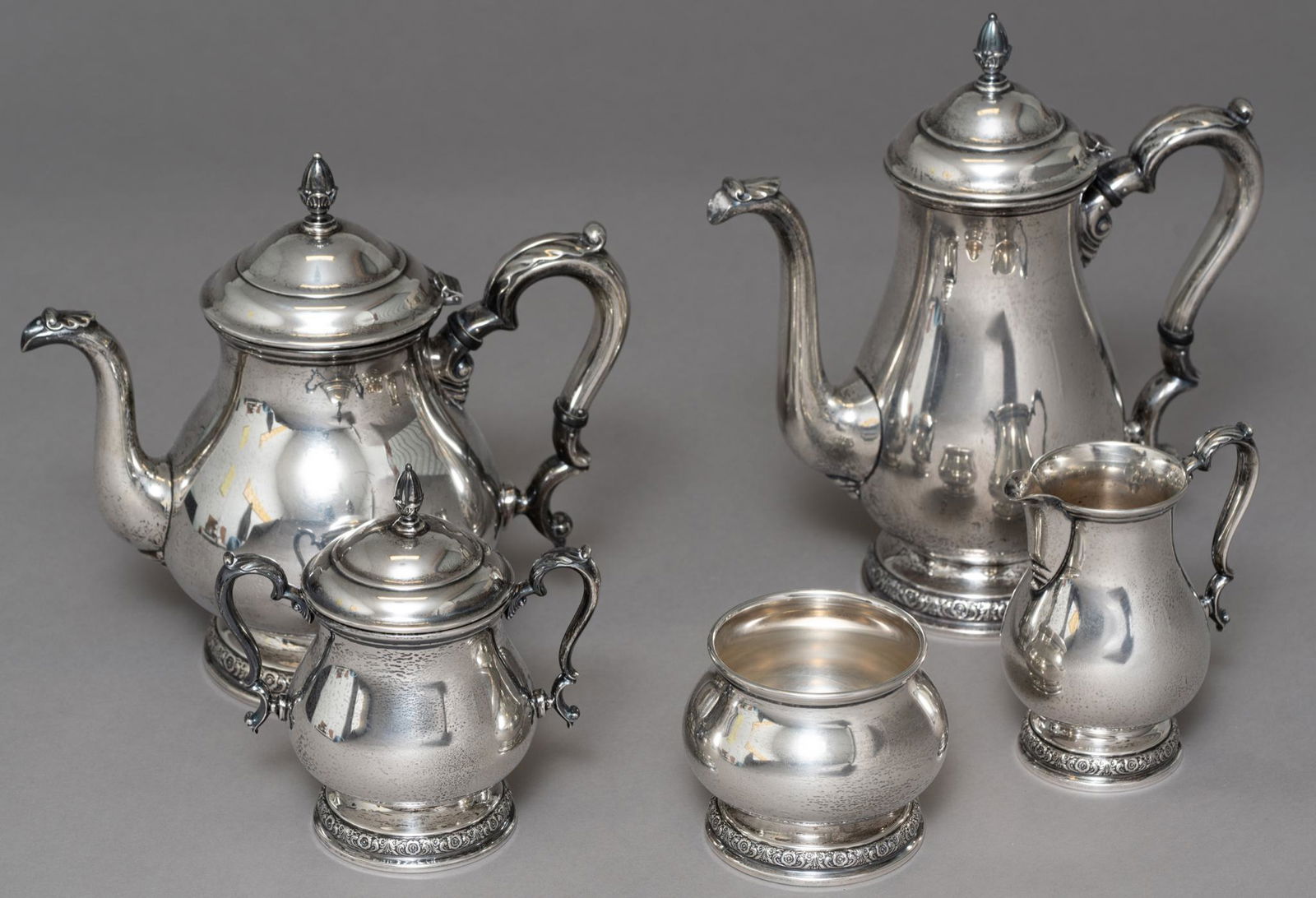 International 'Prelude' Sterling Silver Tea Service Set: Hallmarked: Prelude International Sterling, total weight: 71.77ozt with weight of bone accents, measures: 10.5 x 9.5 x 4.5" (teapot) Provenance: A San Antonio, Texas collection