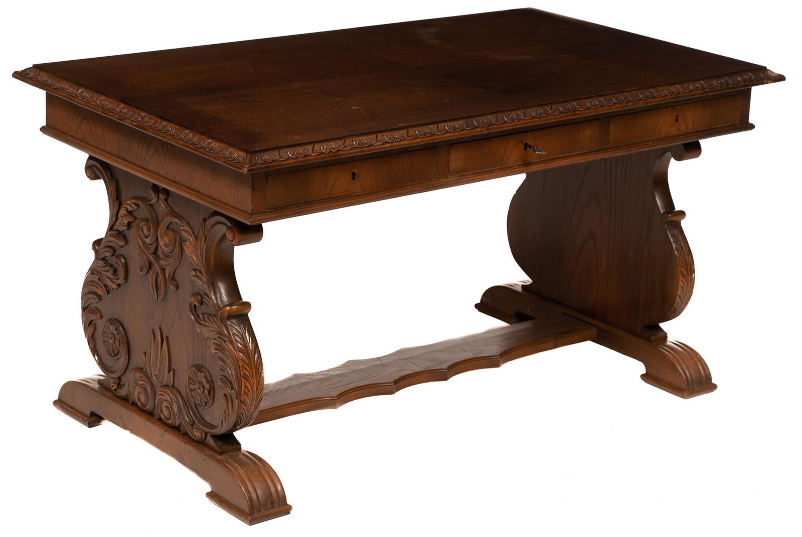 Italian Renaissance-Style Desk: Italian Renaissance-style writing desk, carved top on three drawers, includes key, rising on heavily carved stretchered lyre legs 32"h x 60"w x 34"d State wide delivery is available for this item. Ple