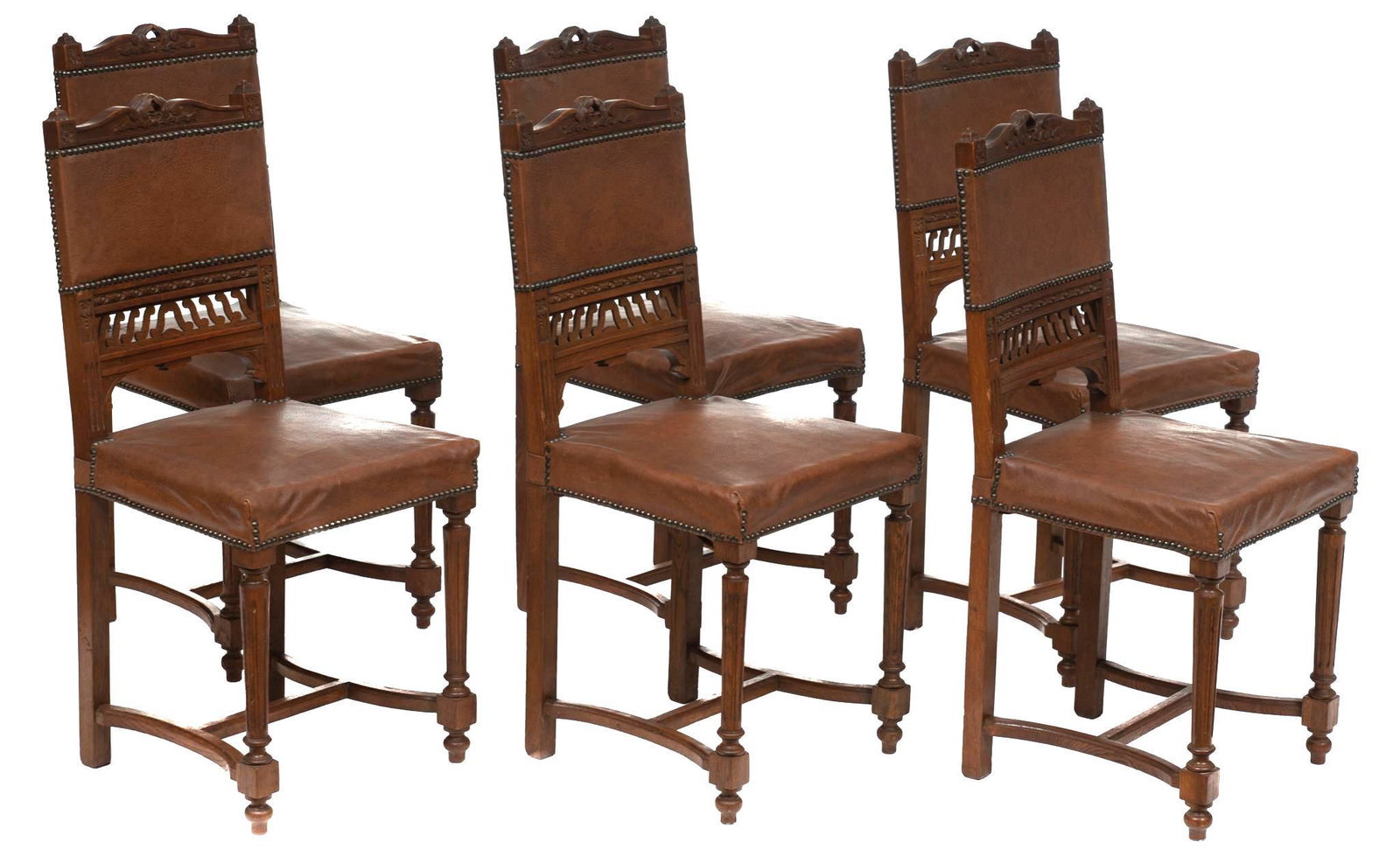 Set of 6 Henri II Leather Dining Chairs: Set of six Henri II castle dining chairs, leather with carved backs, nail head trim, rising on turned stretchered legs 37.5"h x 18"w x 16"d/ each State wide delivery is available for this item. Please