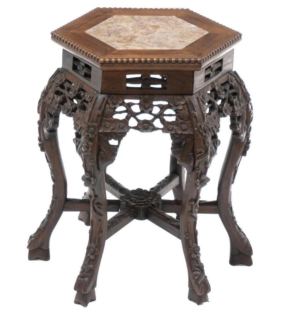 Asian Marble Top Occasional Table: Heavily carved floral motif Asian occasional table, hexagon brown marble top, rising on six heavily carved legs with hoof feet 20"h x 16"w x 14"d In-house shipping and delivery is available on this it