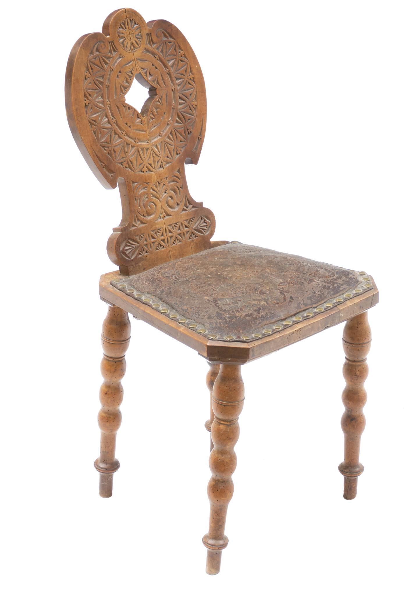 Anglo Saxon Style Monastery Chair: Anglo Saxon style carved monastery chair, nail head trim on leather seat, rising on turned legs 35"h x 16"w x 19"d State wide delivery is available for this item. Please email shipping@vogtauction.com