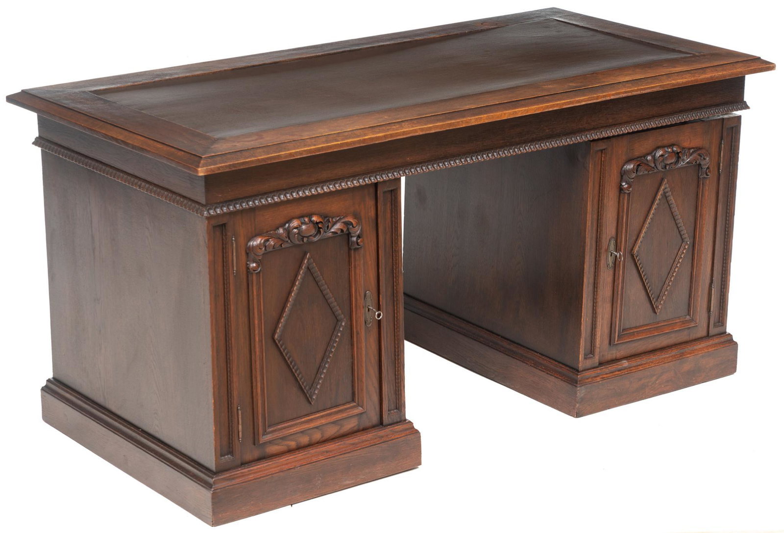 Henri II Style Knee Hole Desk: French Henri II style knee hole desk, block front with carved accents, dipped writing surface, two doors open to shelved interior with three internal drawers, includes key 31 x 63 x 32" We happily pro