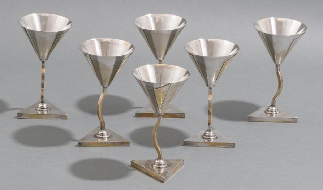 Elsa Tennhardt Rare Set of 6 Cocktail Cups: A set of 6 rare silver-plated brass cocktail cups in a modernist design by Elsa Tennhardt, manufactured by E. & J. Bass Company, New York, NY. Includes: 6 x Cocktail cups Dimensions: 5" tall appro