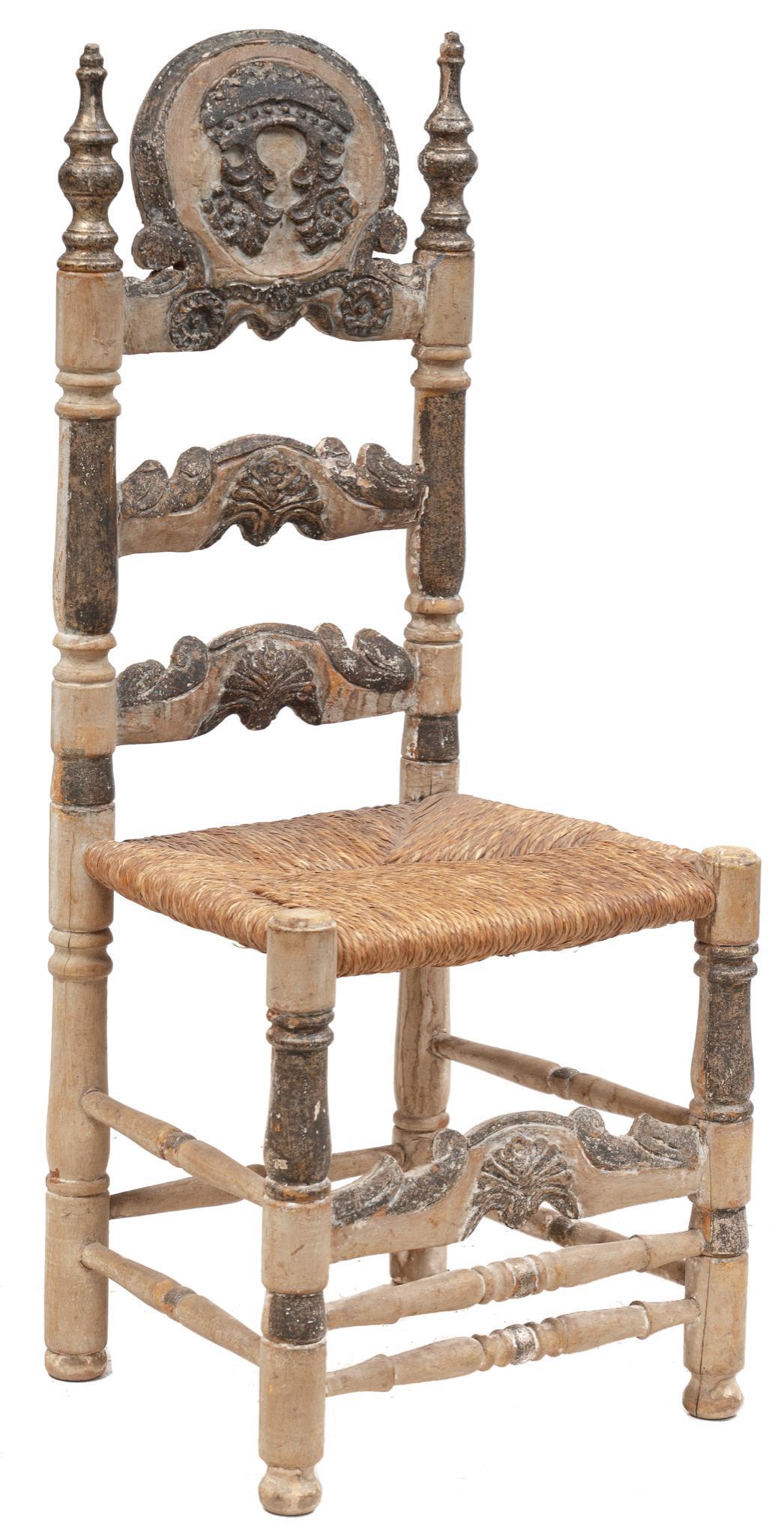 Spanish Coat of Arms Throne Chair: Spanish throne chair bearing a coat of arms, circa 19th century, carved, rush seat, rising on turned stretchered legs 48 x 20.5 x 18"; Provenance: The Collection of Chris Hill (San Antonio, TX) We