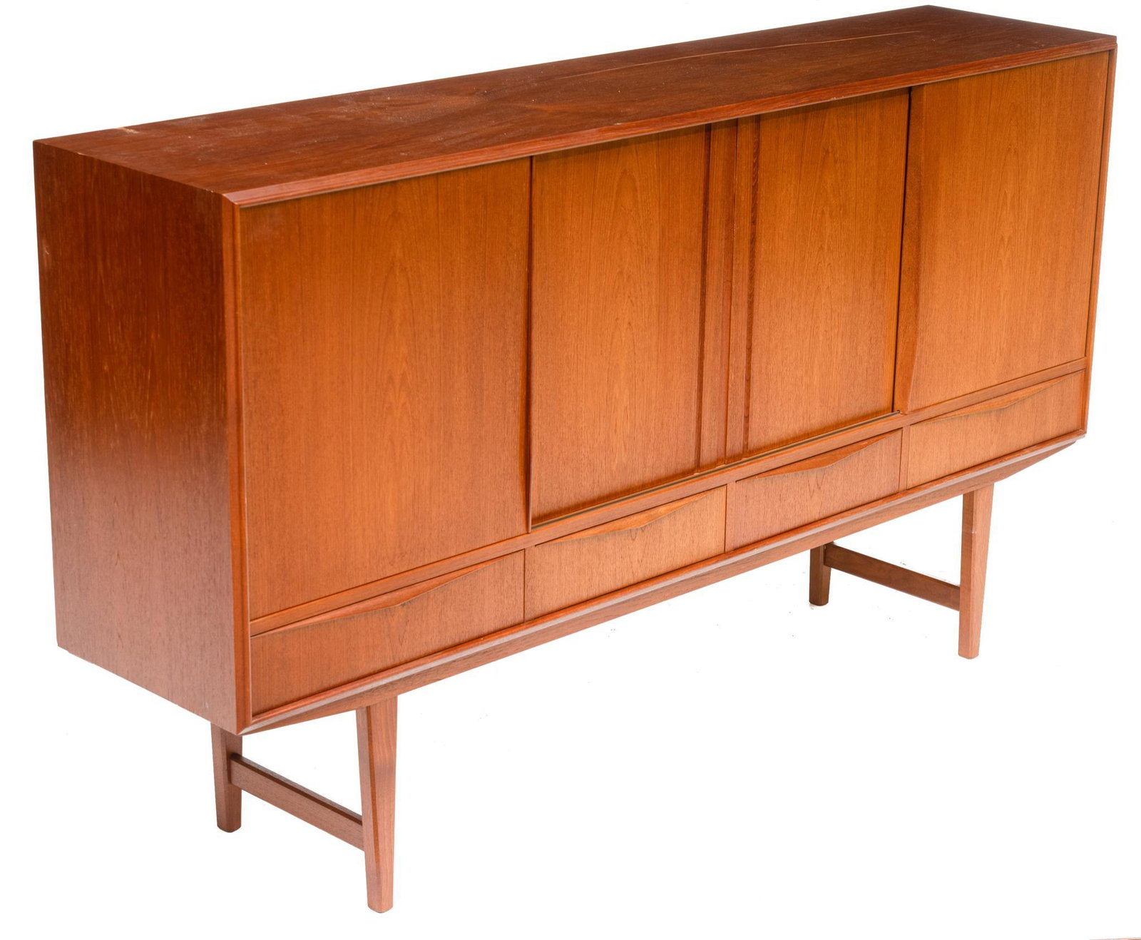 Danish Mid-Century Sideboard: Danish Mid-Century sideboard, four sliding doors open to shelved and mirrored interior with two drawers, above four drawers, rising on stretchered pin legs 44.5"h x 77.5"w x 17.5"d Condition: Minor da