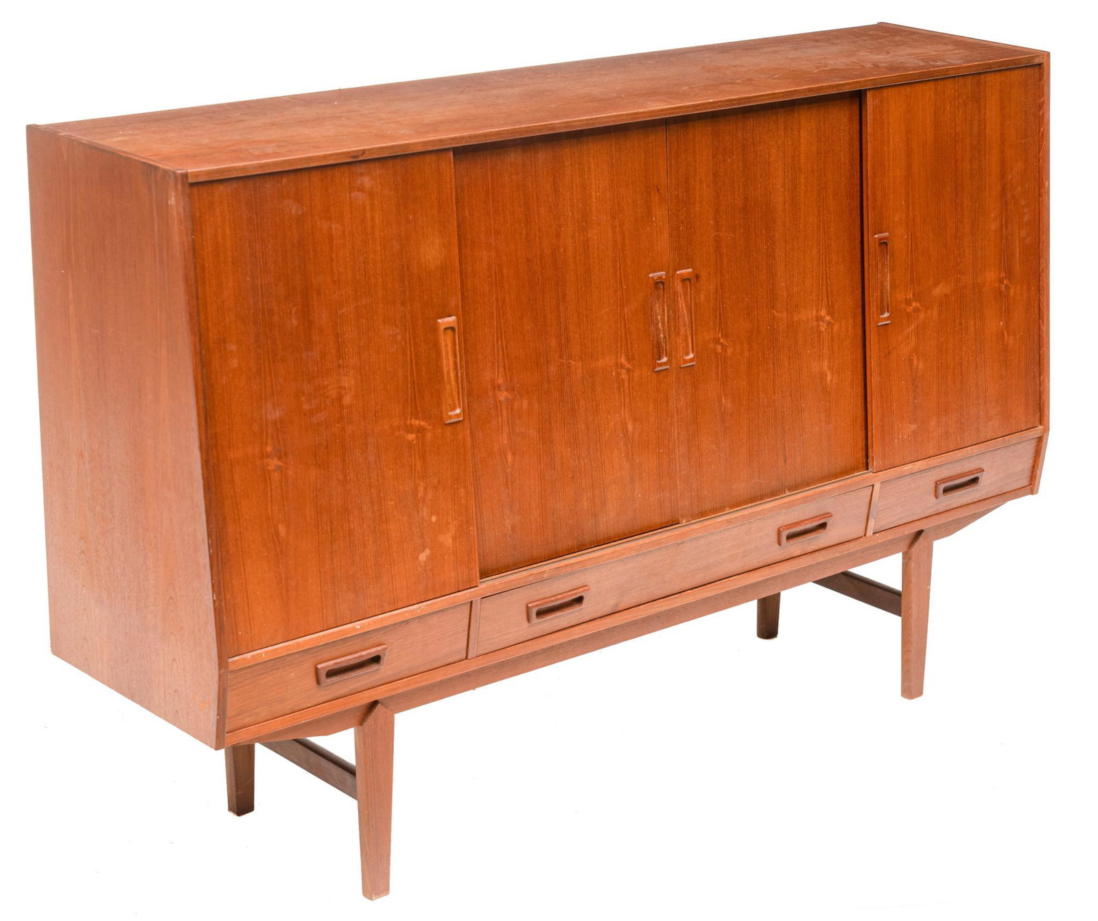 Danish Mid-Century Sideboard: Danish Mid-Century sideboard, four sliding doors open to shelved and mirrored interior, with valuables drawers, over four drawers, rising on stretchered pin legs 45"h x 71"w x 16"d We happily provide 