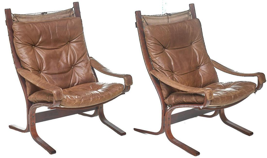 Pair of Danish Mid-Century Leather Arm Chairs: Pair of Danish Mid-Century arm chairs, brown leather, bent wood base 36"h x 28"w x 29"d/ each We happily provide seamless shipping services on everything we sell. Please email us at shipping@vogtaucti