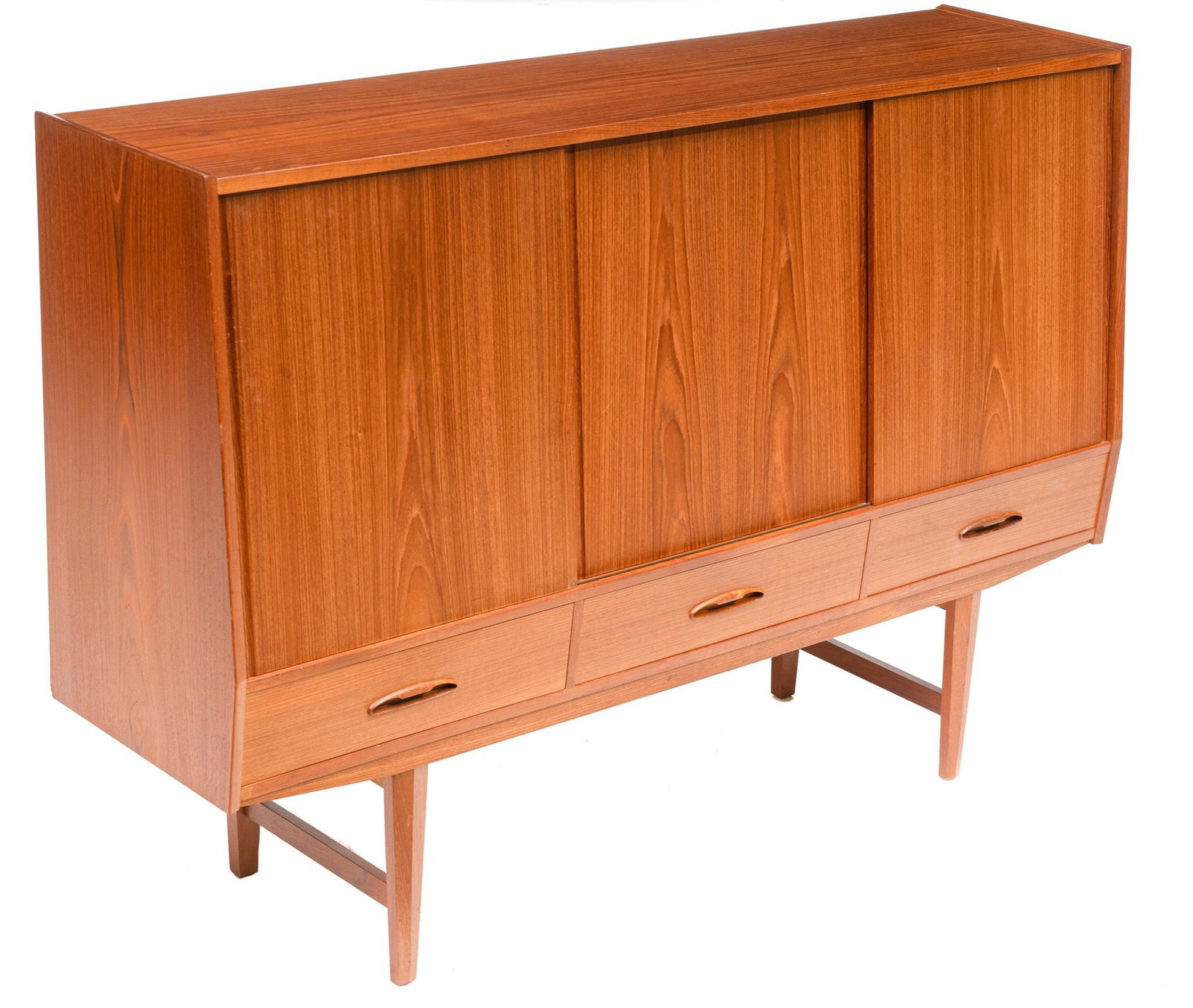 Danish Mid-Century Sideboard: Danish Mid-Century sideboard, three sliding doors open to shelved and mirrored interior, with valuables drawers, above three drawers, rising on pin legs 46.5"h x 67"w x 18.5"d We happily provide seaml
