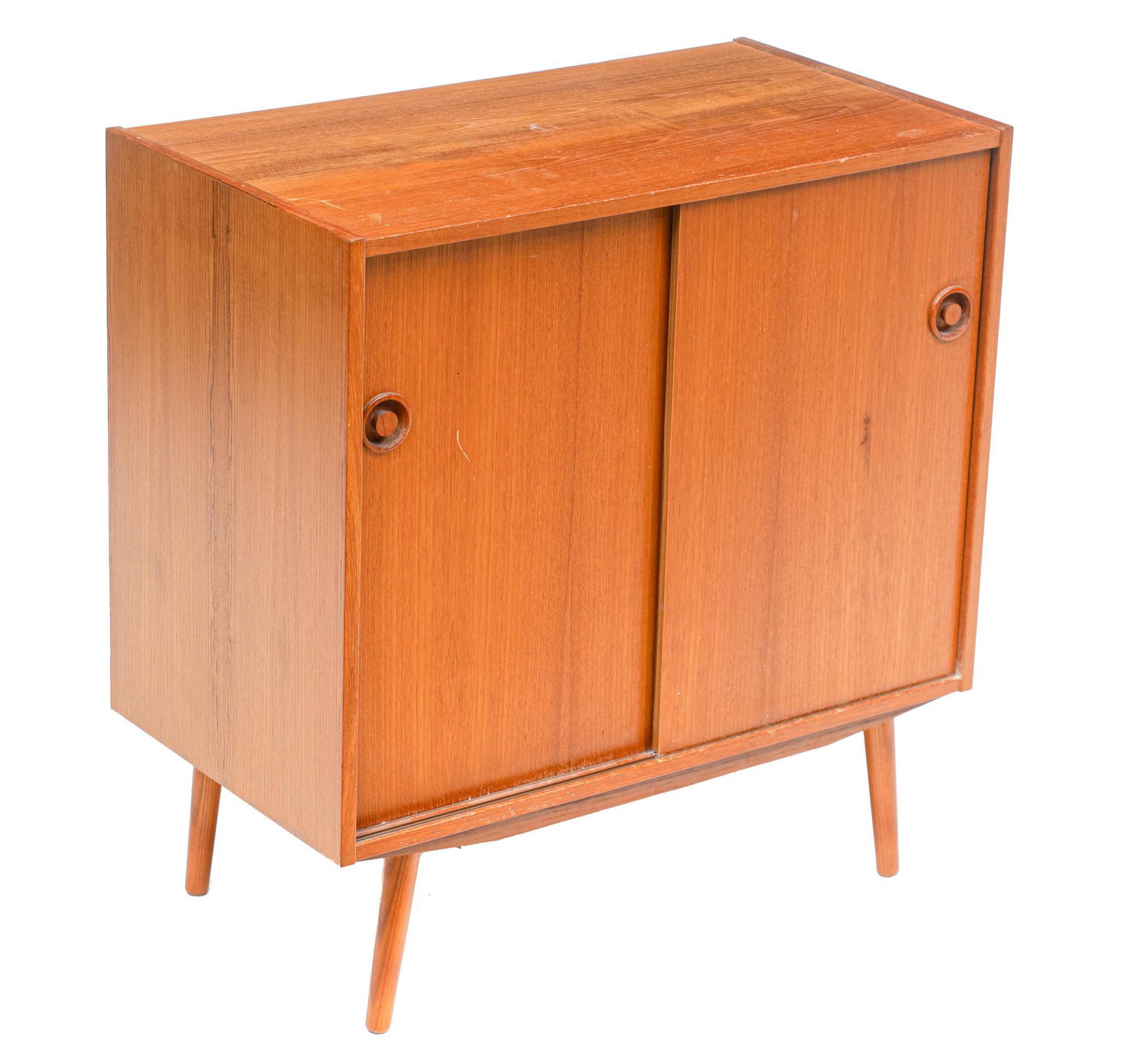 Danish Mid-Century Credenza: Danish Mid-Century credenza cabinet, two sliding doors open to shelved interior, rising on pin legs 33"h x 31.5"w x 17"d We happily provide seamless shipping services on everything we sell. Please ema