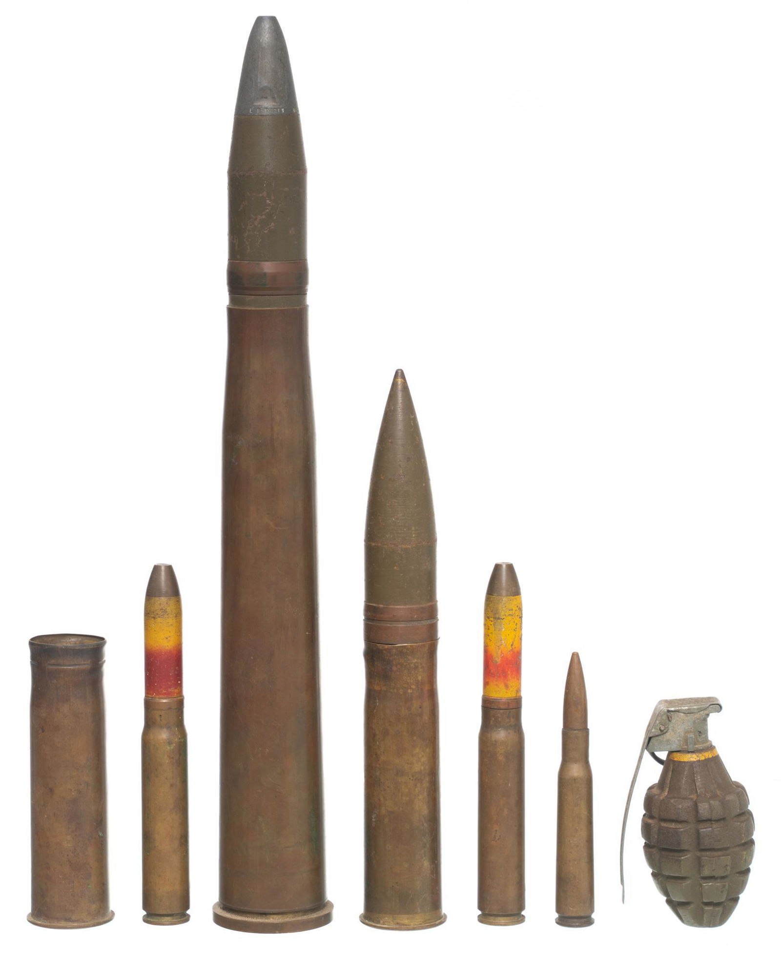 7 Pieces of Deactivated Military Ordnance: Includes: -Mk 2 Pineapple Grenade; 4.5" tall; empty cavity and deactivated fuse -SL 43 marked .50 cal round; empty casing & loose bullet; 5.5" tall -S.M.C. 1943 20mm M21A1 round; empty cas