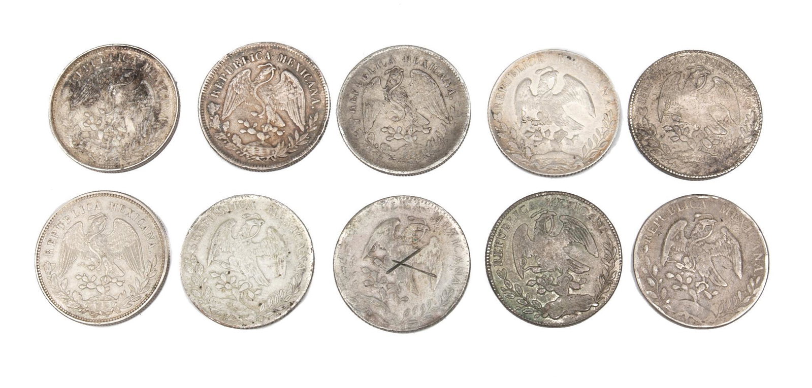 10 Silver Mexican Cap & Ray Un Peso Coins: Includes: 7.8oz. total -1875, 1876, 1888, 1891 (2), 1895, 1900, 1902, 1903, 1908 Provenance: Inventory from the now closed Cristina's Jewelry (San Antonio, TX) We will happily provide seamless shi