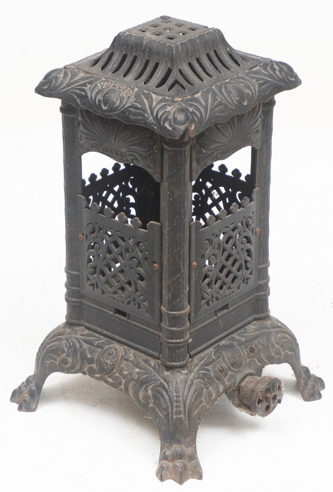 Small Iron Vulcan Stove: Small farmhouse iron stove, marked Vulcan 21"h x 9"d Provenance: A Castle Hills, TX Estate We happily provide seamless shipping services on everything we sell. Please email us at shipping@vogtauct