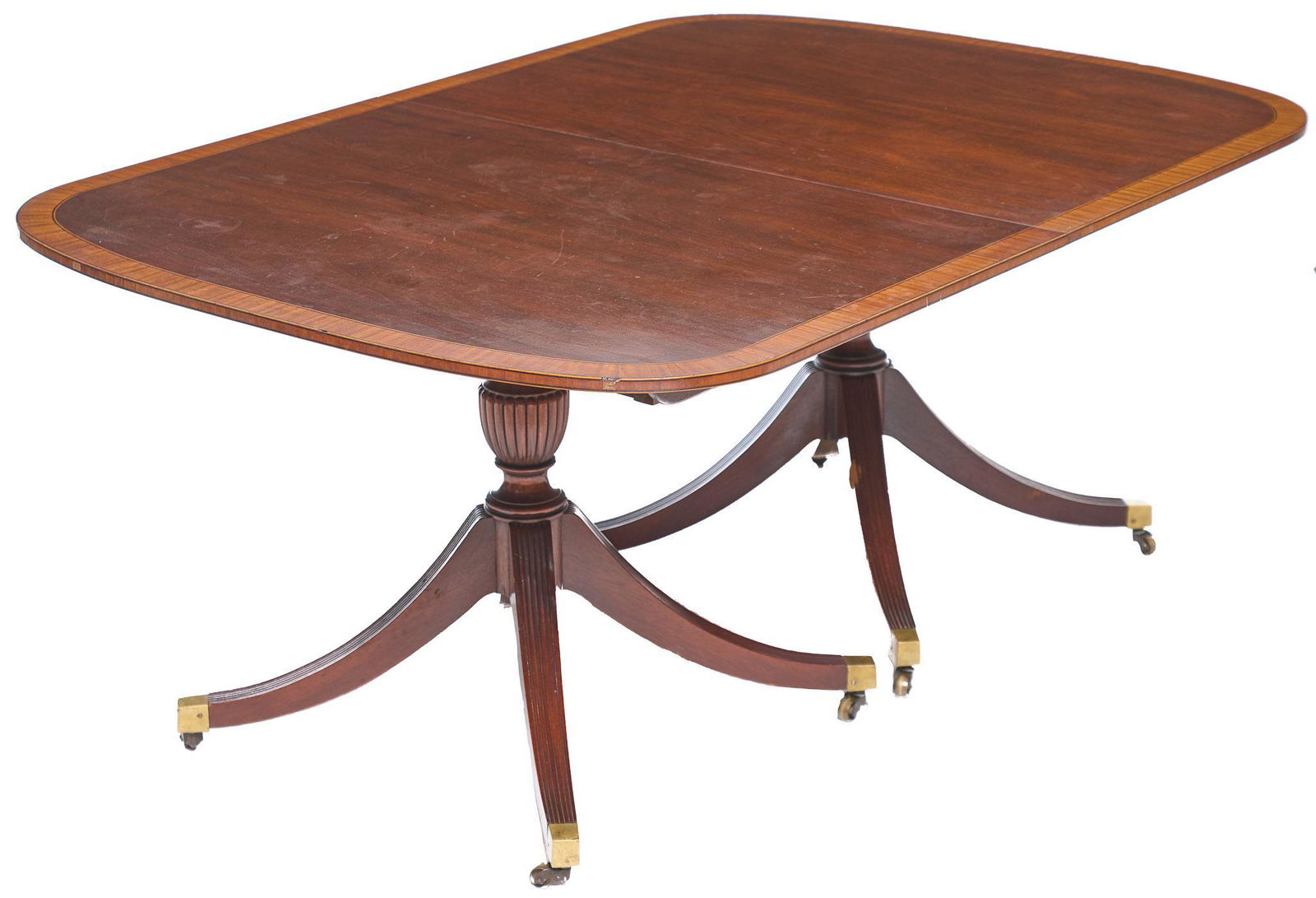Duncan Phyfe Style Extendable Dining Table: Duncan Phyfe style dining table, includes three leaves, dual done top, rounded edges, rising on pedestal legs with brass casters 29.5"h x 124"w x 48"d We happily provide seamless shipping services o