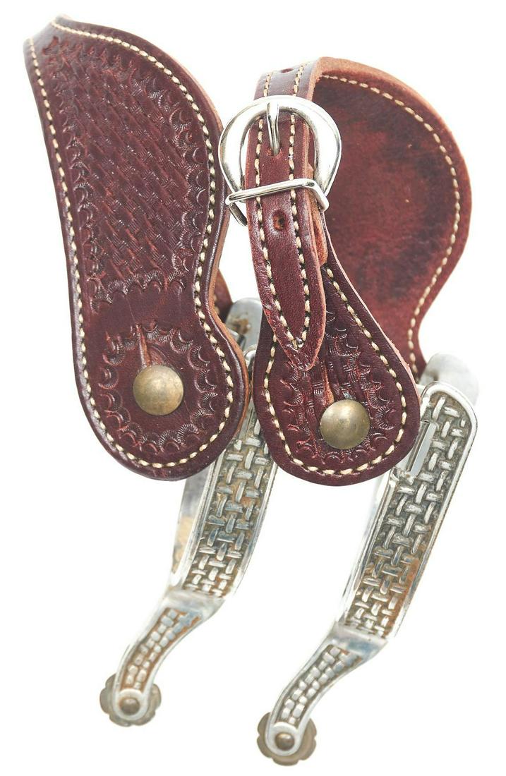 Modern Riding Spurs with Basket Straps: Modern riding spurs with basket stamped straps Provenance: An Alamo Heights Collection We happily provide seamless shipping services on everything we sell. Please email us at shipping@vogtauction.co