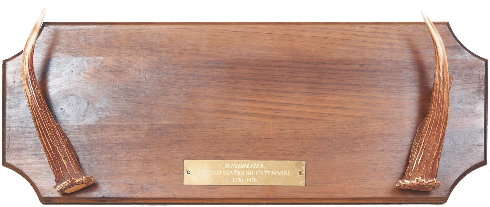 Winchester U.S. Bicentennial Gun Rack: Winchester branded U.S. Bicentennial (1776-1976) taxidermy gun rack, deer horn mounts on wooden plaque 9"h x 21"w Provenance: A Shavano Park, TX Collection We happily provide seamless shipping service