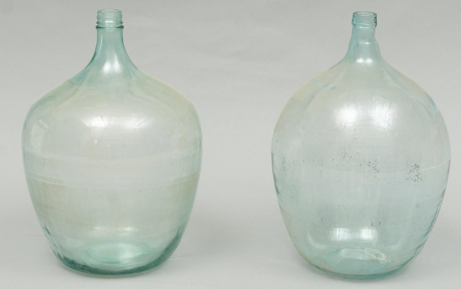 Pair of Vintage Hand Blown Glass Carboys: Pair of vintage hand blown blue glass carboys, vineyard wine fermenting bottles 21"h x 13"d/ largest We happily provide seamless shipping services on everything we sell. Please email us at shipping