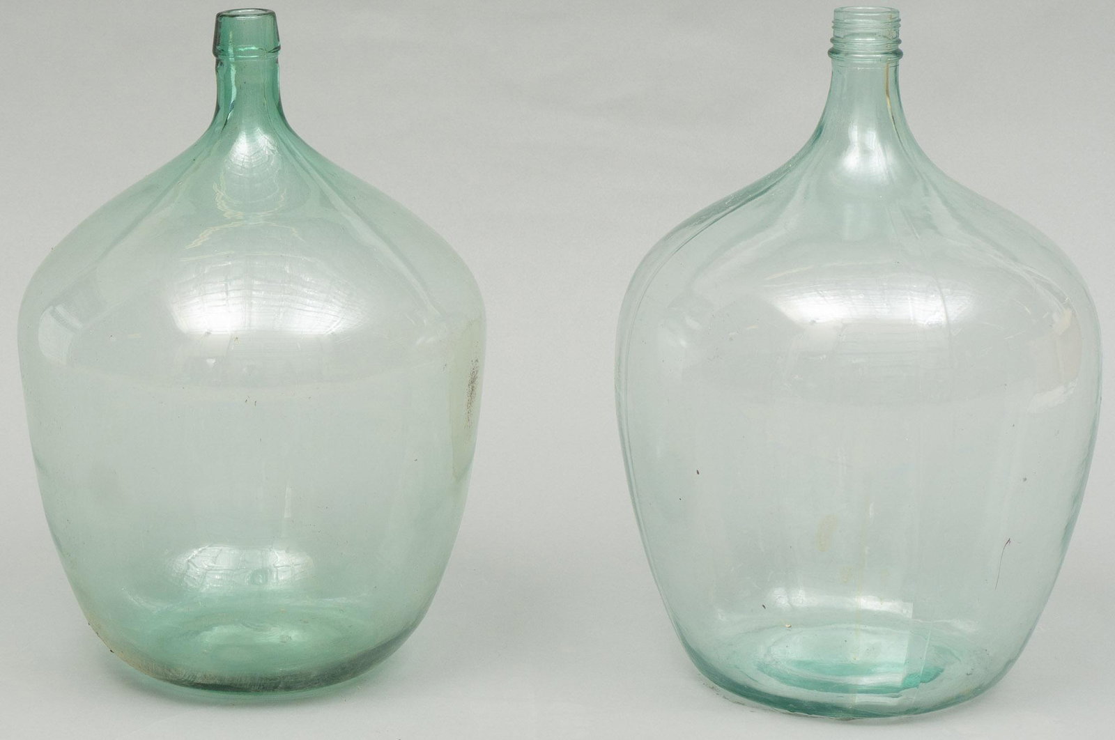 Pair of Vintage Hand Blown Glass Carboys: Pair of vintage hand blown clear glass carboys, vineyard wine fermenting bottles 21"h x 12"d/ largest We happily provide seamless shipping services on everything we sell. Please email us at shipping