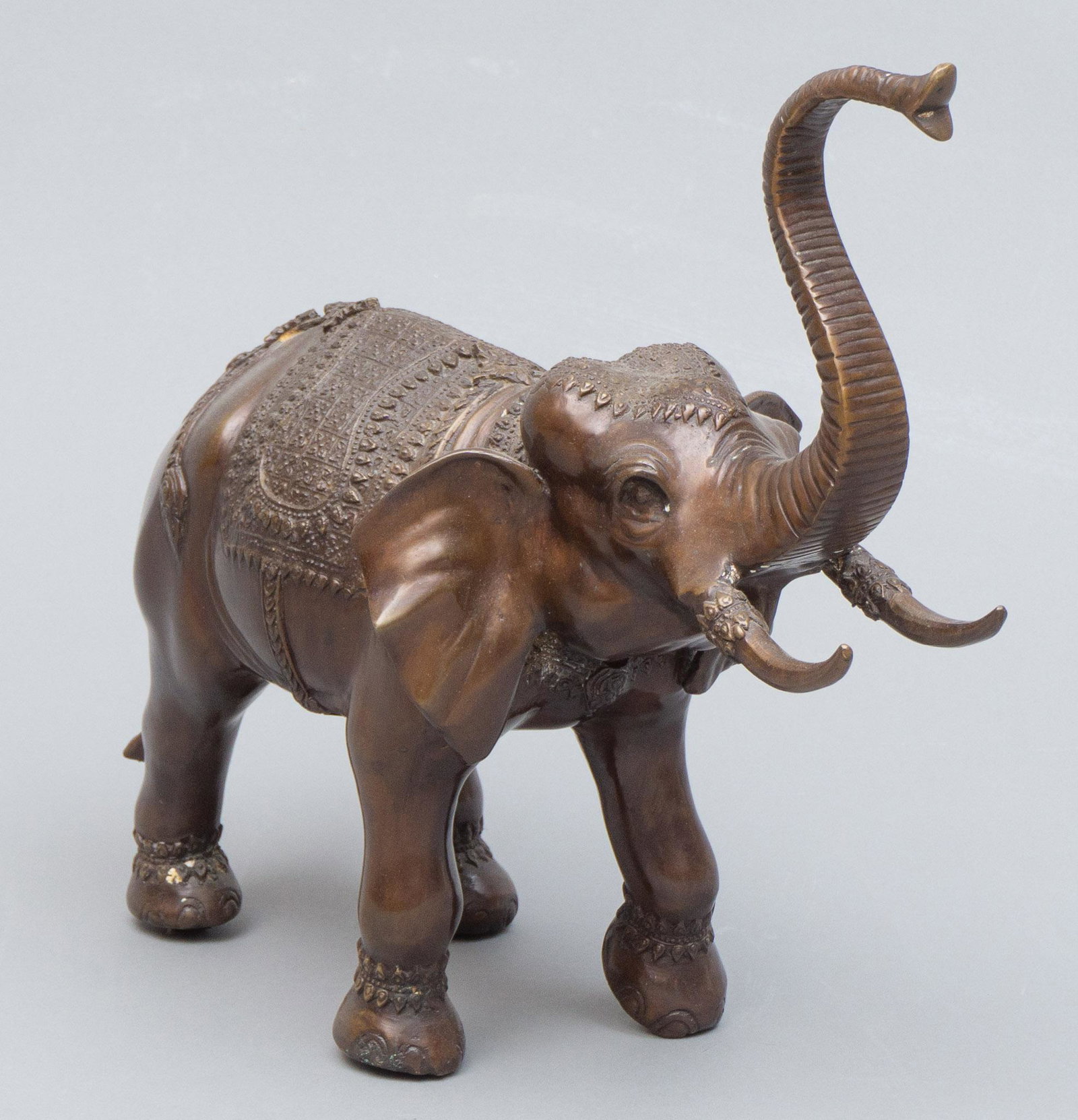 Vintage Bronze Indian Elephant Figure: Vintage bronze Indian elephant figure 15"h x 16"w x 7"d Provenance: A San Antonio, TX Estate We happily provide seamless shipping services on everything we sell. Please email us at shipping@vogtauctio