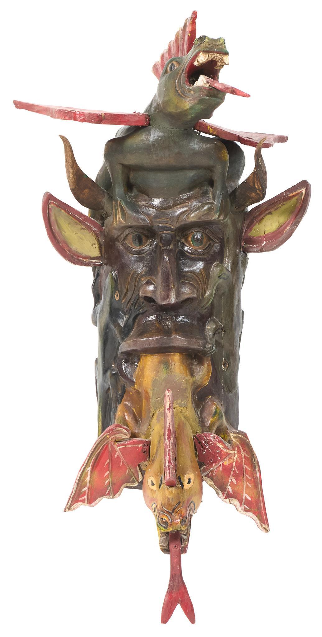 Manner of Jose Rodriguez (20th C., MEX), Folk Art Mask: Mexican folk art mask in the manner of Jose Rodriguez School (20th C., Mexico), depicting a two serpent horned devil, circa 1920s 42"h x 19"w x 20"d Provenance: A Hollywood Park, Texas collection W