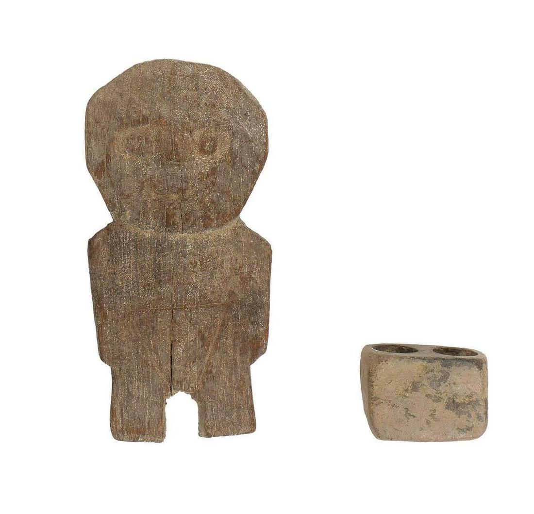 Peruvian Carved Fetish and Candle Holder: Pair of Peruvian artifacts, to include carved wooden fetish and pottery candle holder 8"h x 3.5"w x 1"d Provenance: A San Antonio, Texas collection We happily provide seamless shipping services on eve