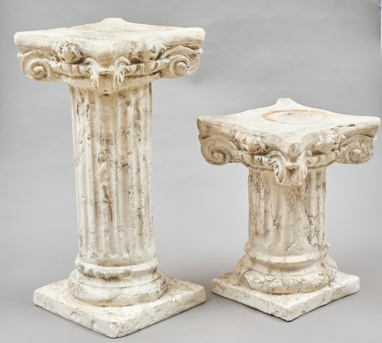 Pair of Garden Plaster Pedestals: Pair of white garden plaster pedestals 30"h x 14.5"d/ largest Provenance: A San Antonio, TX Collection We happily provide seamless shipping services on everything we sell. Please email us at s