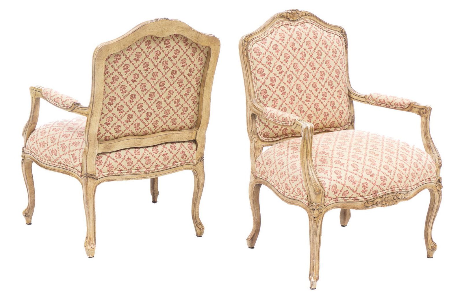 Pair of French Provincial Bergere Arm Chairs: Pair of French Provincial bergere arm chairs, having arched mantle with patterned upholstery, with carved accents, rising on cabriole legs 38.5"h x 27"w x 20"d/ each Provenance: A San Anto