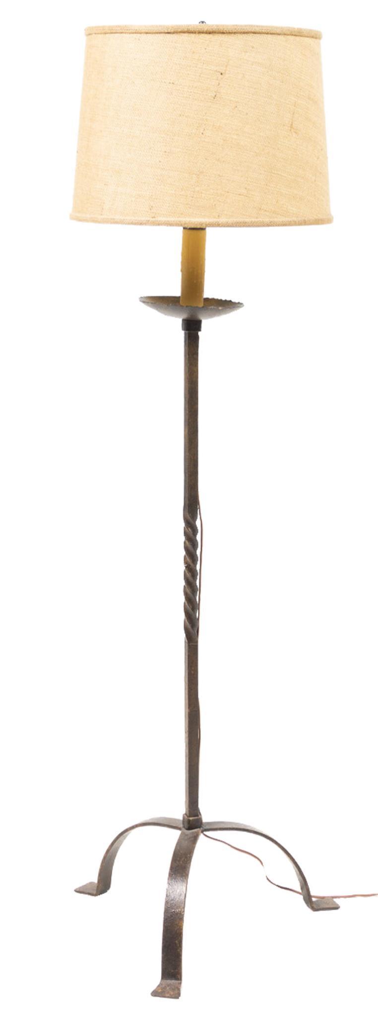 W.R. Dallas (San Antonio, TX) Wrought Iron Lamp: W.R. Dallas (San Antonio, Texas) lamp, having wrought iron tripod pedestal base with tan shade, in working condition 62.5"h x 15"d Provenance: A Rockport, TX Collection We happily provide seamless shi