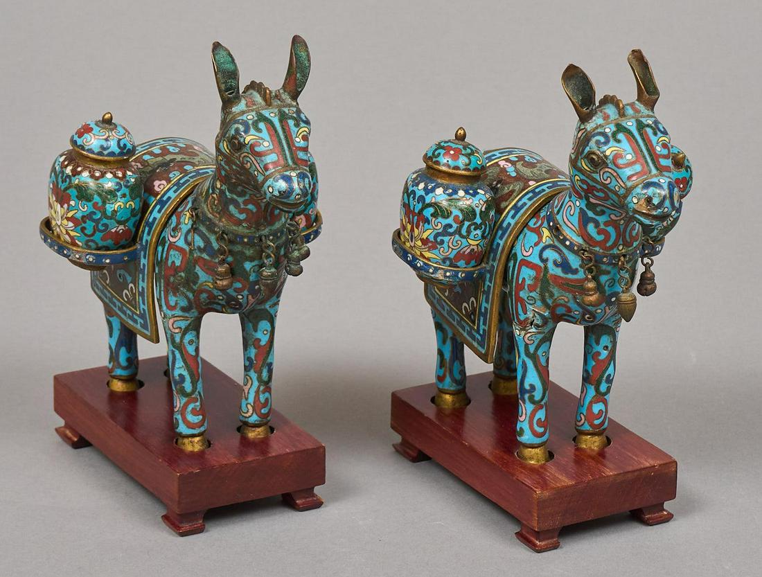 Pair of Chinese Cloisonne Donkeys: Pair of Chinese donkey figures, having colorful metal cloisonne frame on wooden base 7"h x 2.5"w x 4.5"w/ each Provenance: The collection of philanthropist Francie Whittenberg, San Antonio, Texas We h