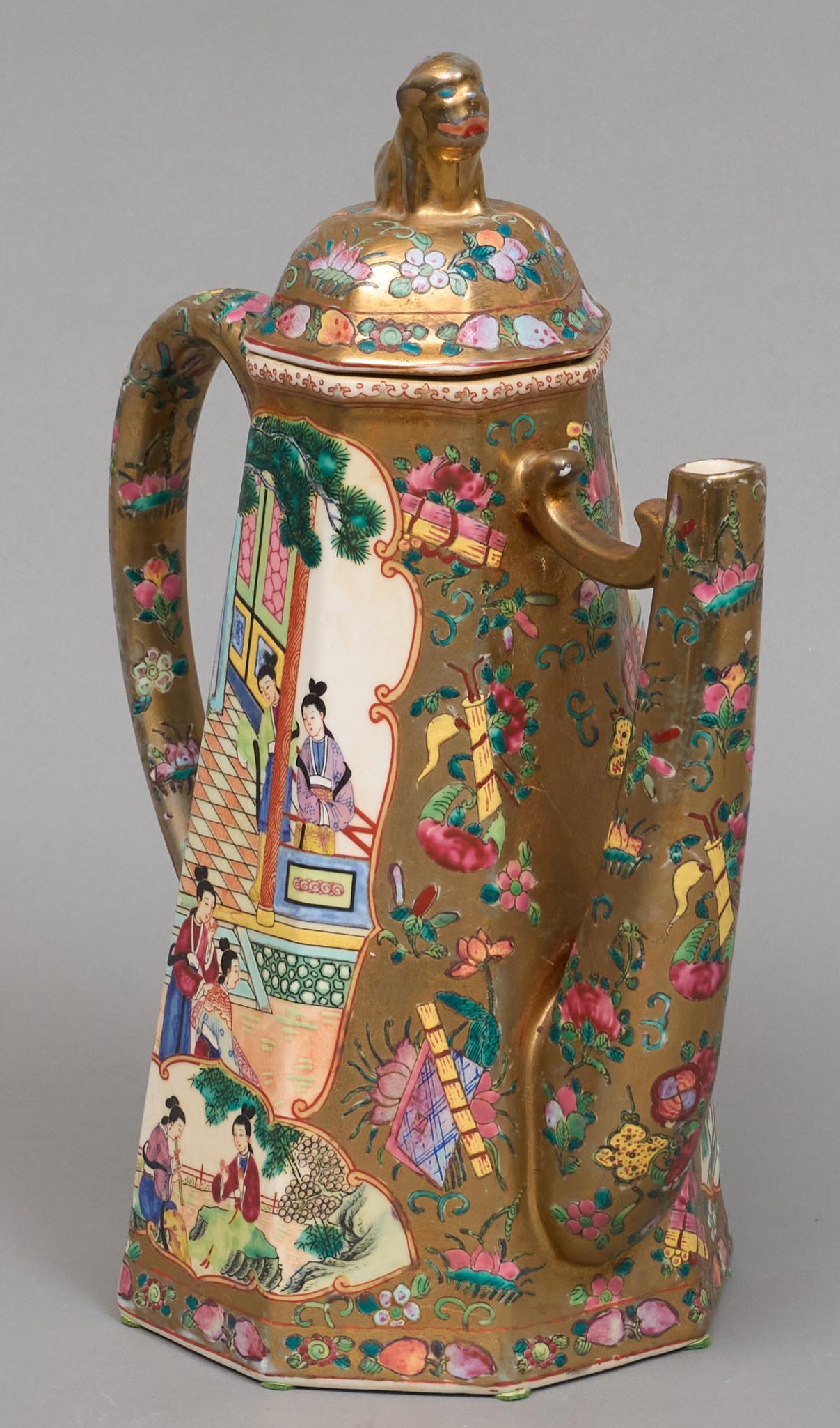 Chinese Porcelain Teapot and Lid with Foo Dog Finial: Chinese porcelain enamelware teapot in the Qianlong style of enamel decoration resembling cloisonne bearing classical scene of women in a courtyard and a scholar's rock on pedestal, surrounded by intr