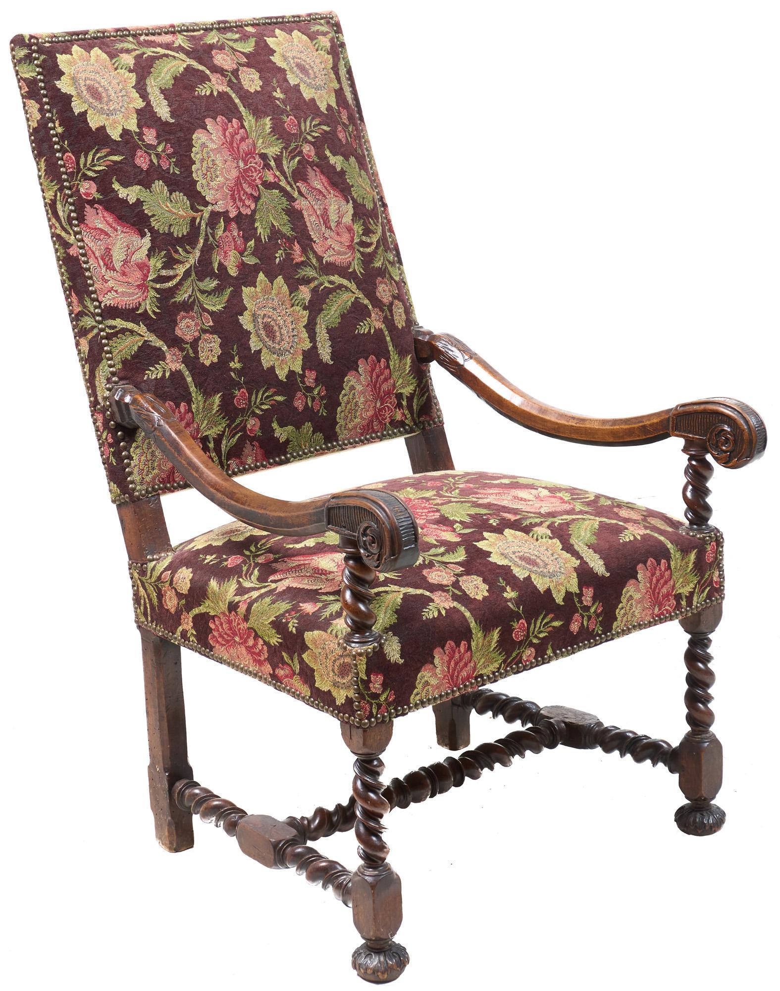 19th C. Upholstered Fauteuil Armchair: English Fauteuil armchair having brocade upholstery and nailhead trim, scrolled arms, composite front legs, straight molded back legs, resting on H-stretcher and flattened bun feet, circa 1890 43"h x 