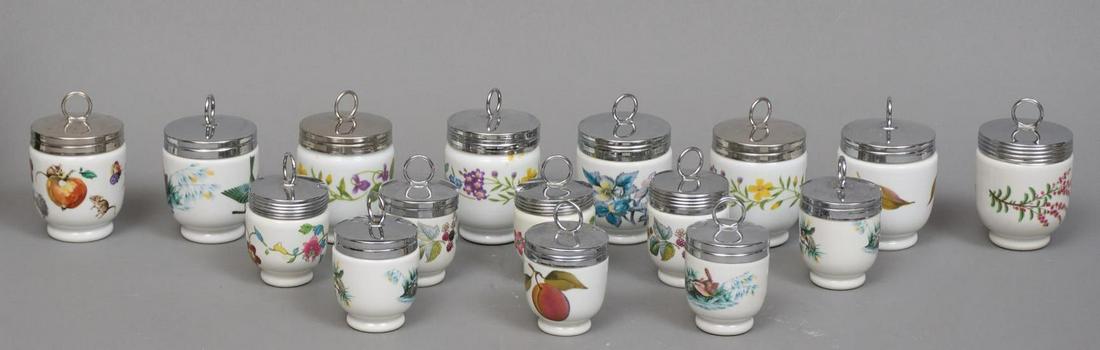 Lot of 16 Condiment Jars: Lot of sixteen porcelain jars with metal lids, each with a different botanical design, marked English on base 4.5"h x 3"d/ largest Provenance: A San Antonio, Texas, collection We happily provide seaml
