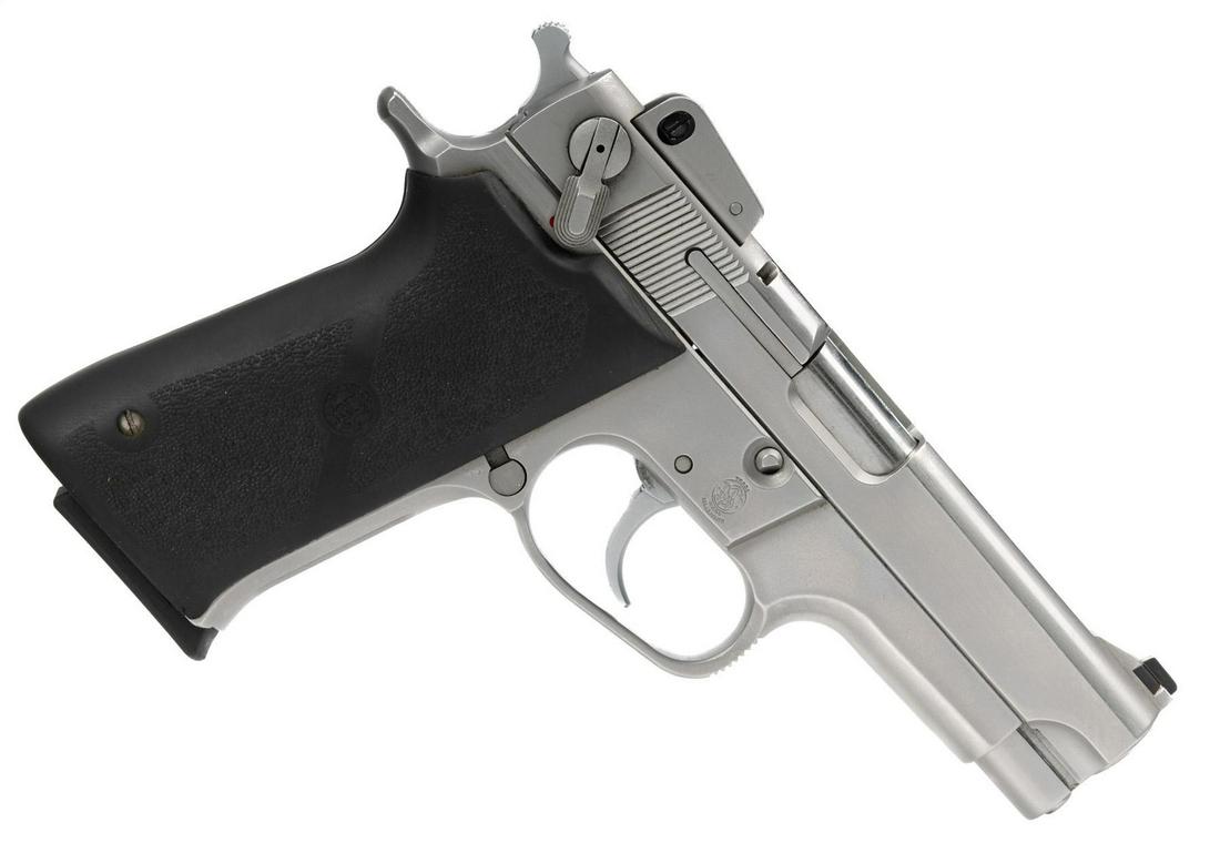 Smith & Wesson Model 5906 9mm Semi-Auto Pistol: Serial: TEV6731 Manufacturer: Smith & Wesson (c.1990) Model: 5906 Caliber: 9mm Barrel length: 4" Condition: Very Good; Hogue rubber grips have light handling marks; handling marks on frame & slide; bo