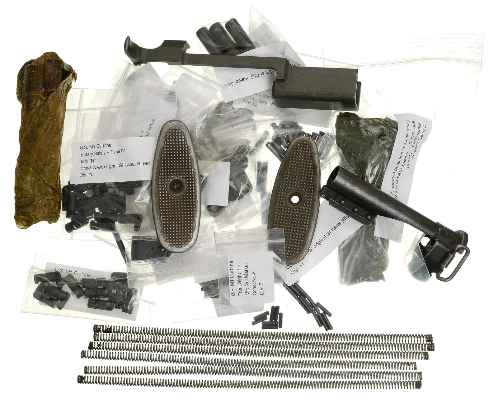Collection of Approx. 130 Individual US M1 Carbine: Includes: -Barrel bands, front & rear sights, bolts, butt plates, ejectors, extractors, firing pins, flash hiders, sight pins & keys, gas piston nuts, mag catches, oilers, operating slides, operating 