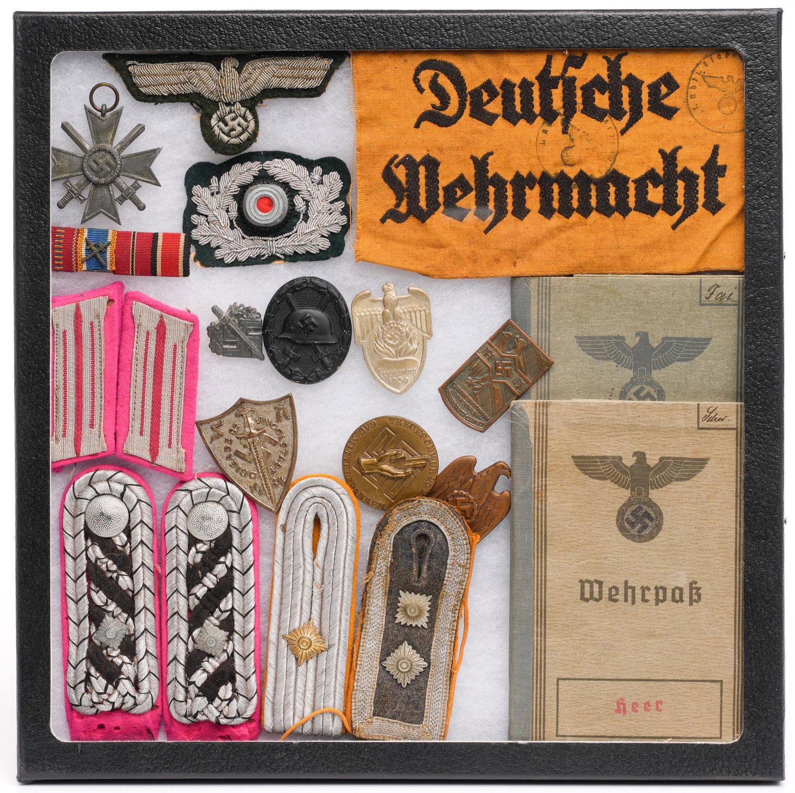 Collection of Nazi Germany Militaria: Includes: -2 Heer Wehrpasses: dated 1937 (Eberhard Scharz) & 1942 (Josef Fouist) -Deutsche Wehrmacht (German Army) yellow armband -Schirmmutze Eagle & Wreath cockade -Luftwaffe flight & paratroopers s