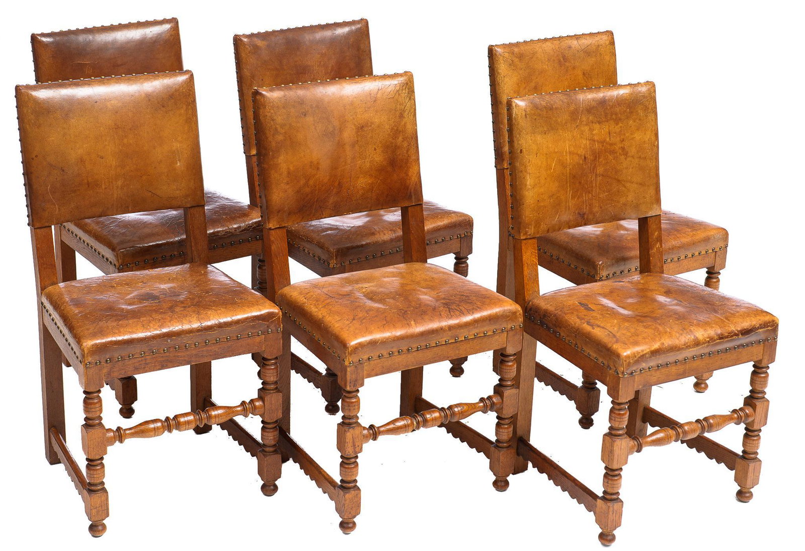 Set of 6 Spanish Dining Chairs: Set of six Spanish dining chairs, featuring leather seat and back with nailhead trim, rising on turned and carved legs 36"h x 18.5"w x 17"d/ each We happily provide seamless shipping services on every