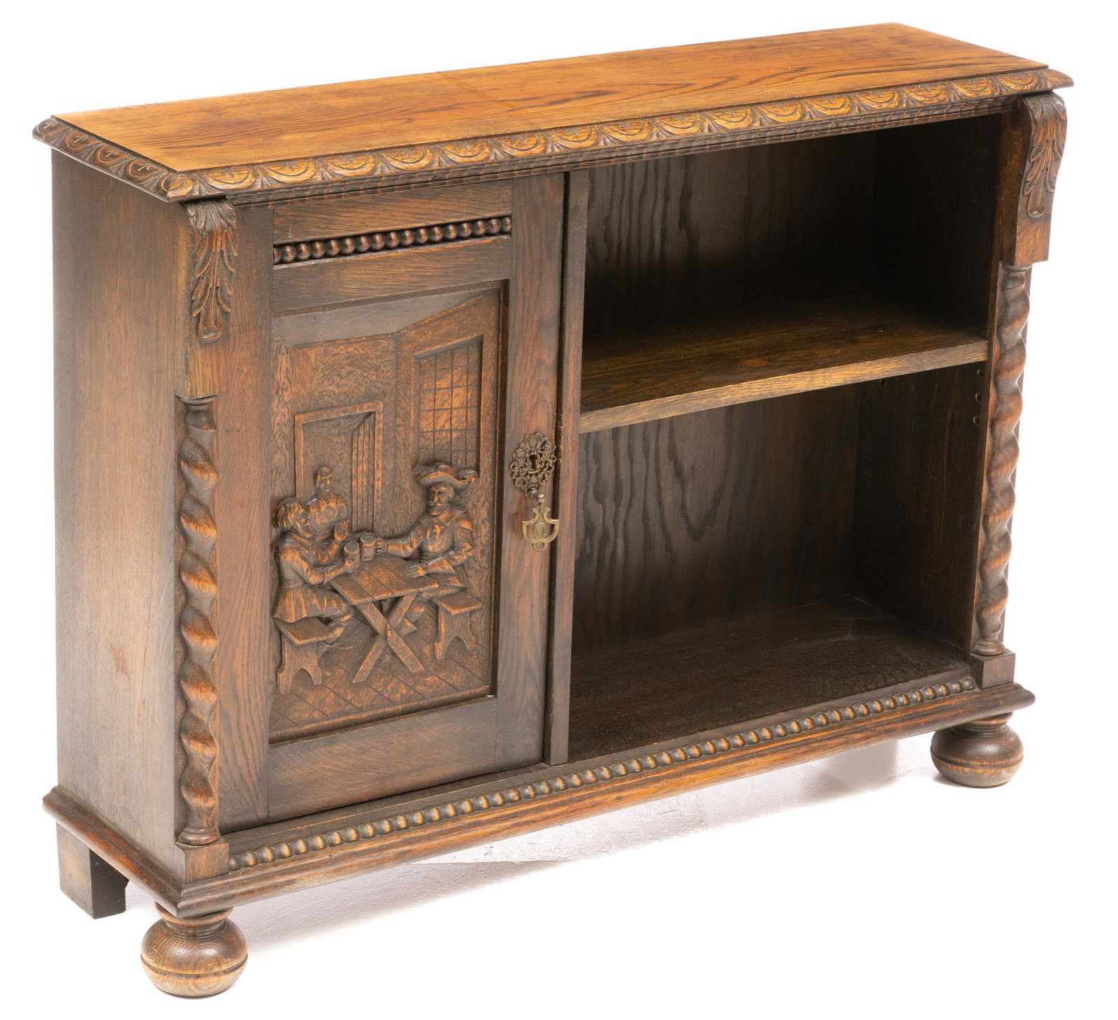 Heavily Carved Side Cabinet: Heavily carved side cabinet featuring carved relief door opening to two shelves, beside open shelves, rising on bun feet, with key 30"h x 39.5"w x 10.5"d We happily provide seamless shipping services 