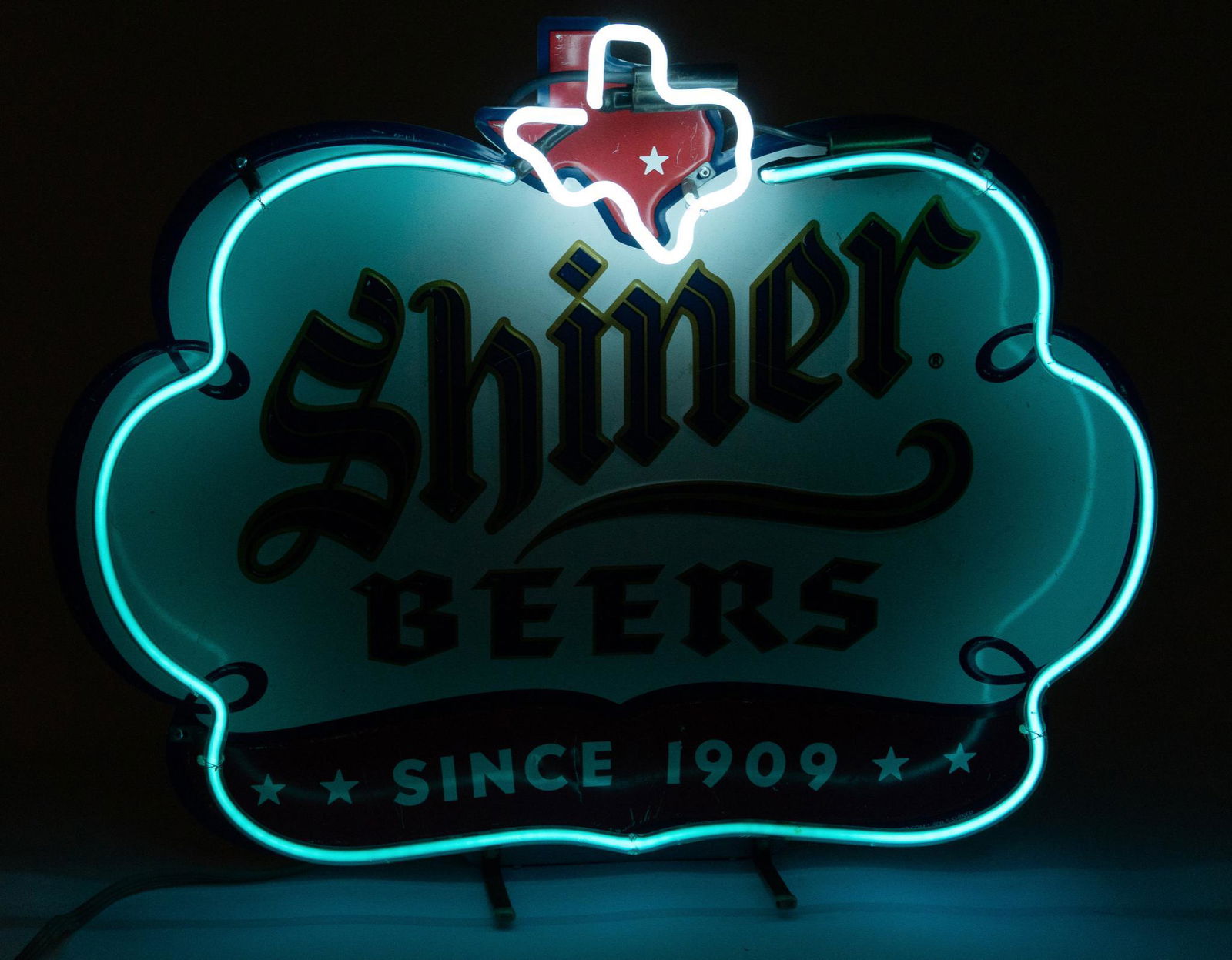 Vintage Shiner Beer Neon Sign: Vintage Shiner Beer neon bar advertising sign, featuring classic cloud with Texas state emblem, "since 1909", light blue and white neon with black and gold stylized lettering, on metal frame, in worki