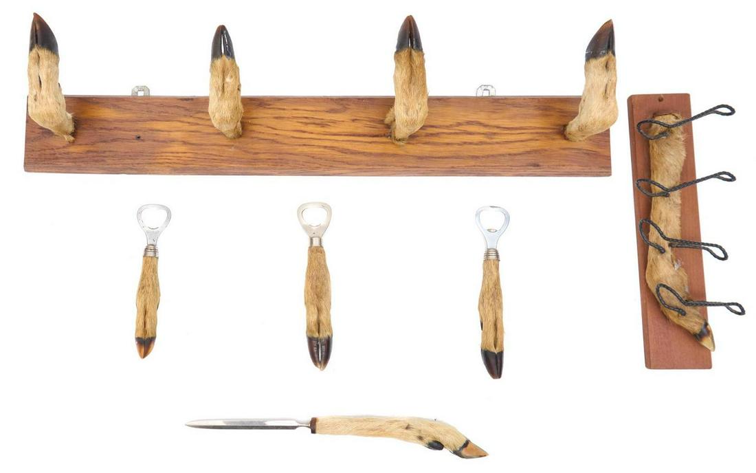 Taxidermy Deer Curated Selection: Taxidermy deer implements including wall rack of four feet and hooves, wall rack of metal hooks, hoof bottle openers, hoof letter opener 5"h x 25"w x 4"d/ largest We happily provide seamless shipping 