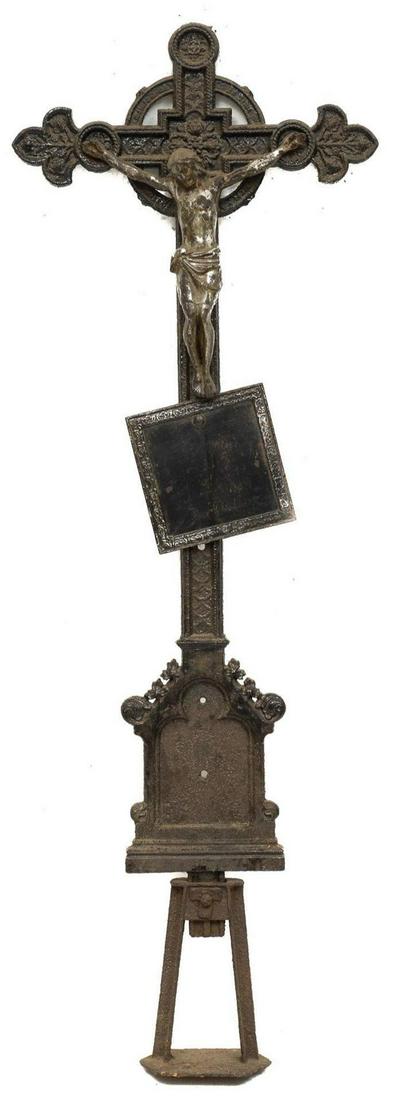 Standing Cast Iron Crucifix: Standing cast iron crucifix featuring figure of Christ, with two unmarked plaques 65"h x 23"w x 4"d We happily provide seamless shipping services on everything we sell. Please email us at shipping@v