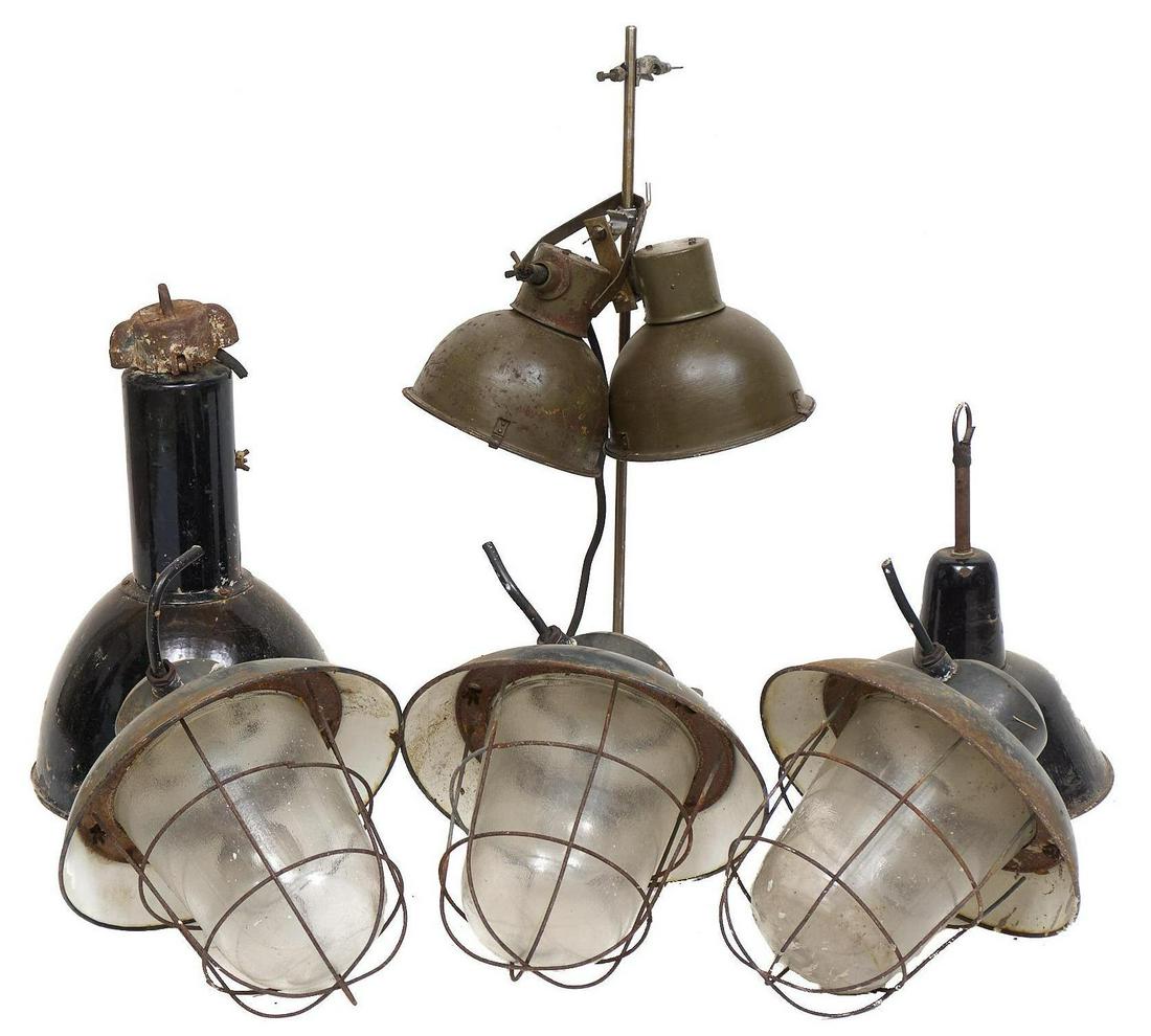 Collection of 7 Industrial Light Fixtures: Collection of seven vintage industrial metal light fixtures, with stand 32"h x 11"w/ largest Condition: Some heavily oxidized We happily provide seamless shipping services on everything we sell. Pleas