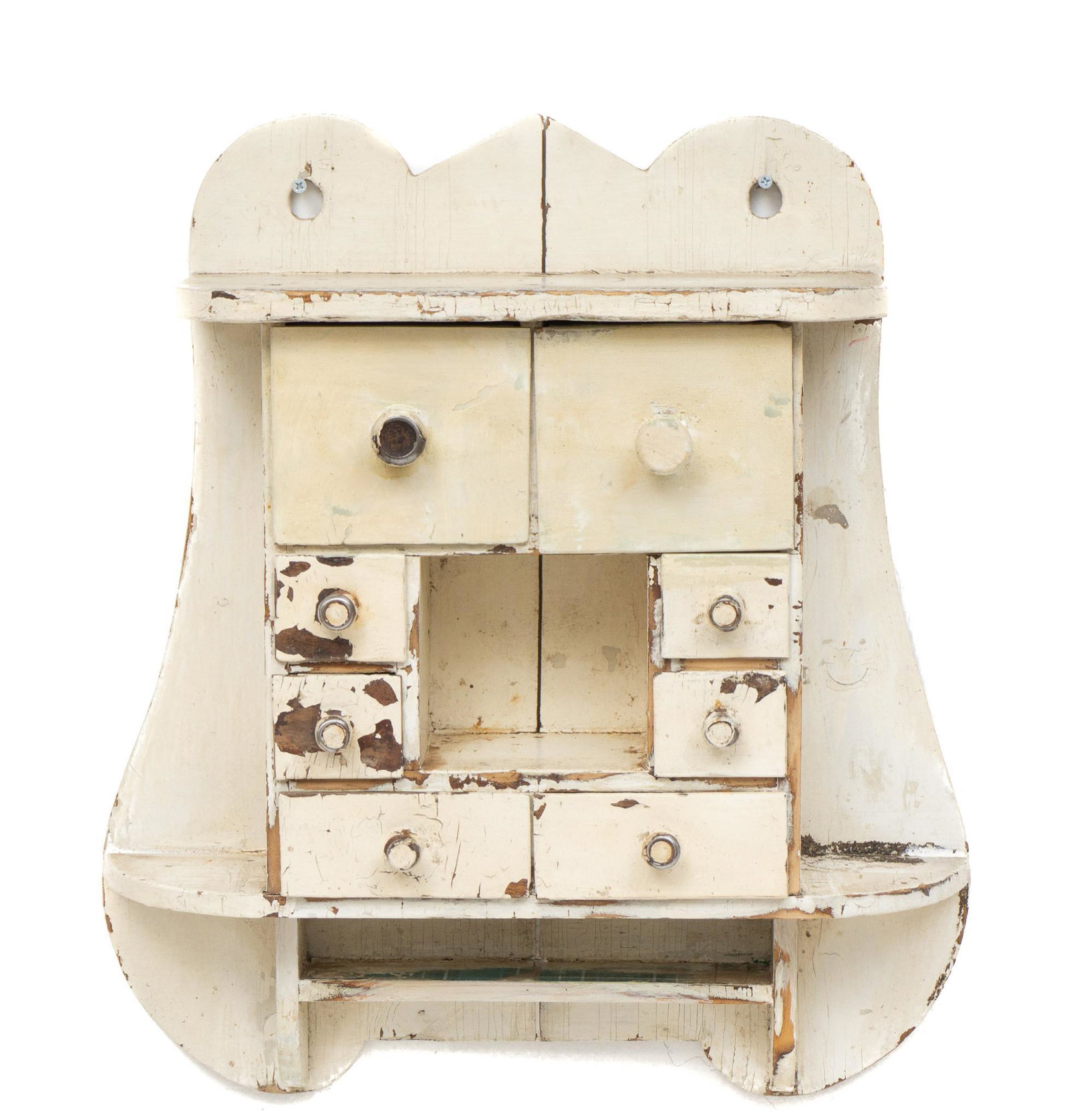 Primitive Wall Hanging Cabinet: Primitive wall hanging cabinet, having white paint remnants with carved mantle and eight drawers 22"h x 19"w x 6"d We happily provide seamless shipping services on everything we sell. Please email us 