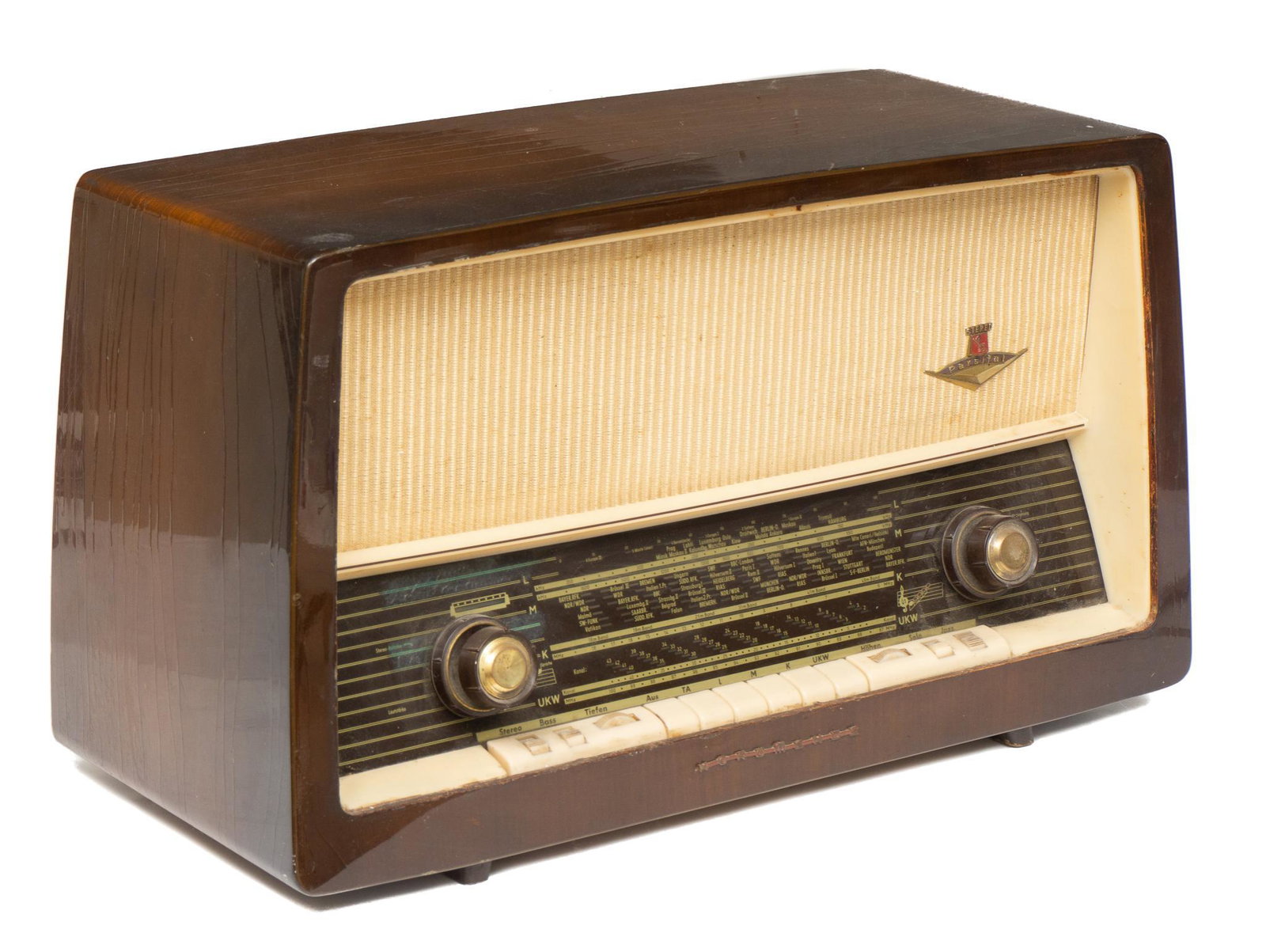 Parsifal-Stereo Retro German Radio: Parsifal-Stereo, German retro radio, table model with wooden case and push buttons, featuring fabric covering 13"h x 21"w x 9.5"d Provenance: A San Antonio, Texas collection We happily provide seamles