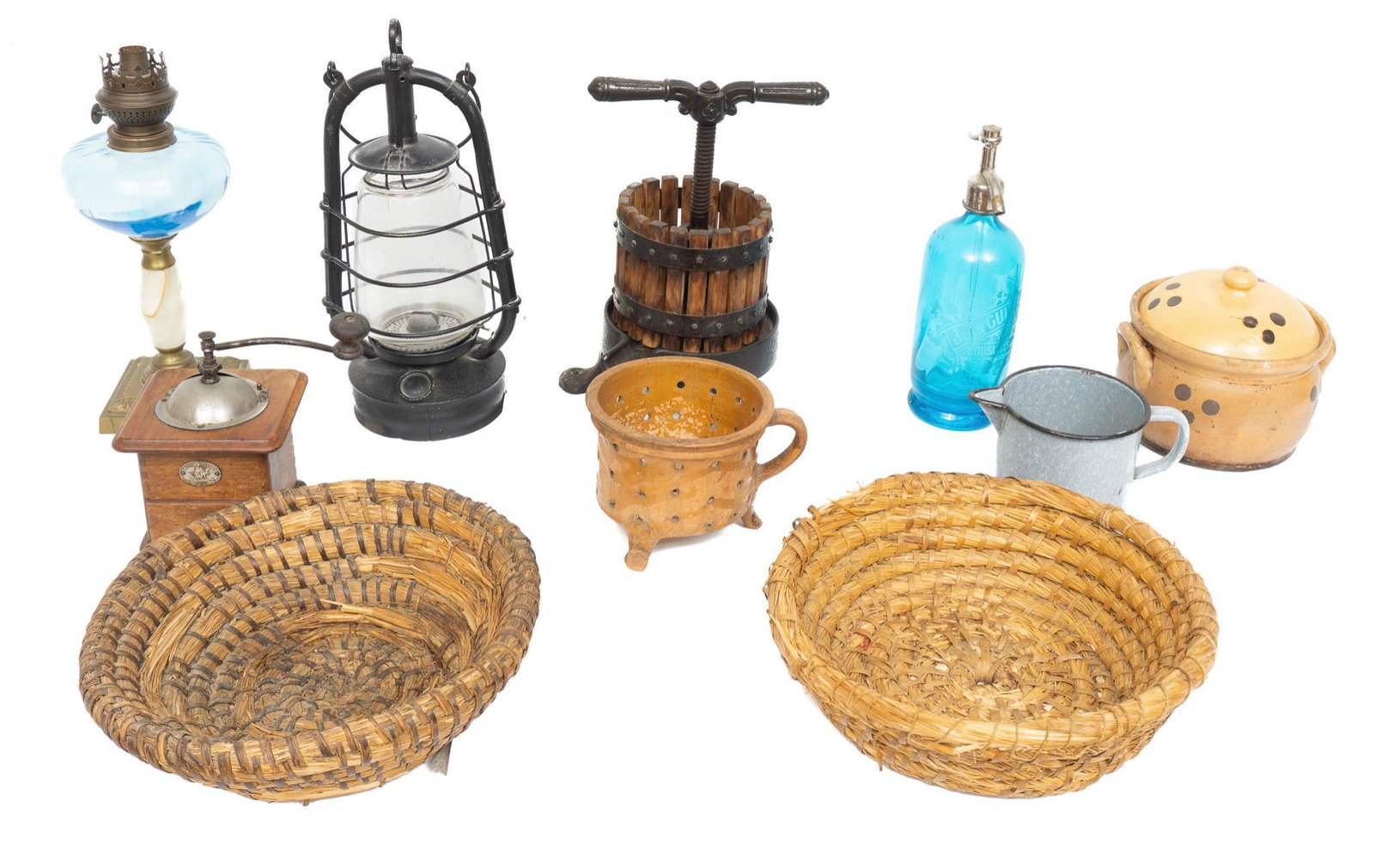 Collection of 10 Misc. Home Goods: Collection of ten misc. home goods, to include woven baskets, blue glass seltzer bottle, miniature wine press, oil lamp, coffee bean grinder, etc 16"h x 12"d/ largest Provenance: A San Antonio, Texas 