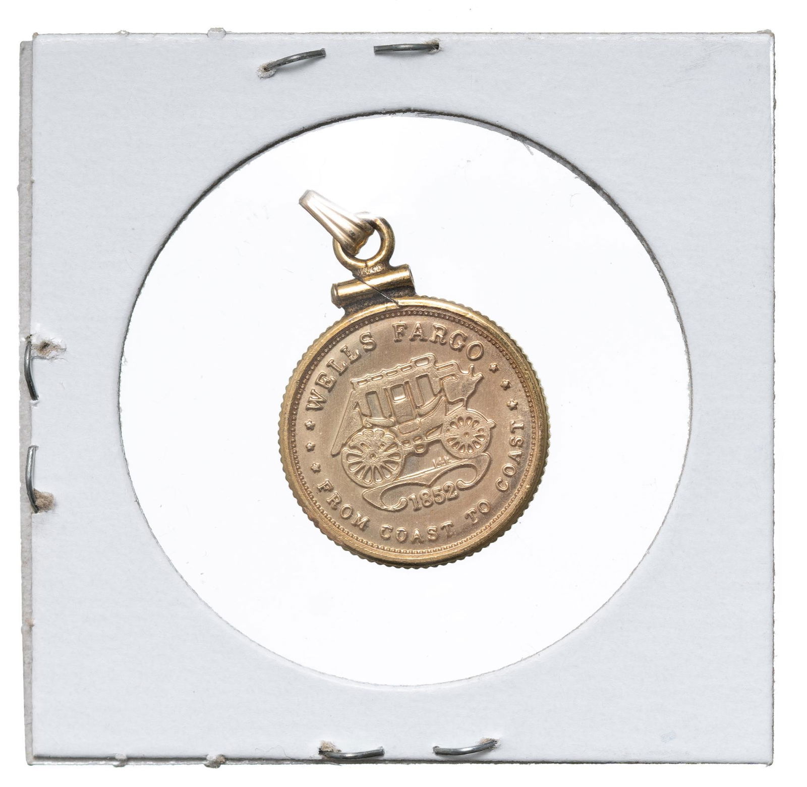Wells Fargo Coast To Coast 14K Gold Token in Pendant: Commemorative 14k gold token, obverse showing the brand stage coach and reads 'Wells Fargo 1852 From Coast to Coast'; the reverse showing a steam engine with the number '60' and reads 'Wells Fargo 186