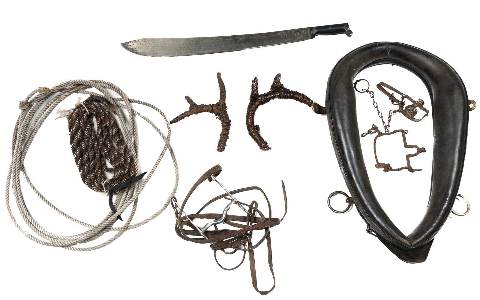 Collection of Misc. Cowboy Goods: Collection of approx. seven pieces of misc. cowboy goods, to include horse tack, rope, machete, one marked "Made in Colombia" 5"h x 18"w x 28"d/ largest Provenance: Inventory from the now-closed Cha