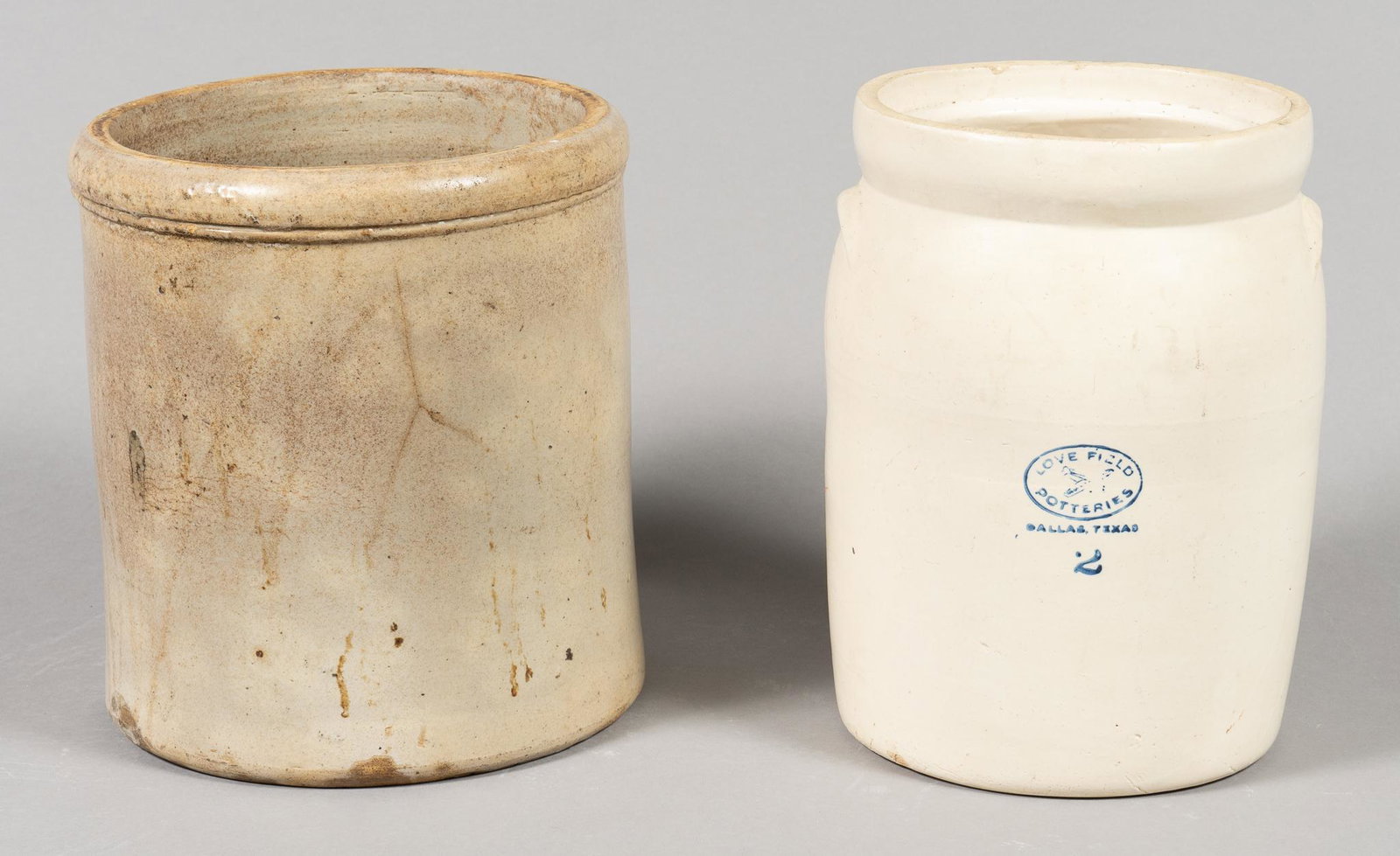 Pair of Stoneware Crocks: Pair of stoneware crocks, to include crock from Love Field Potteries Dallas, Texas 12"h x 11"d/ largest We happily provide seamless shipping services on everything we sell. Please email us at shipping