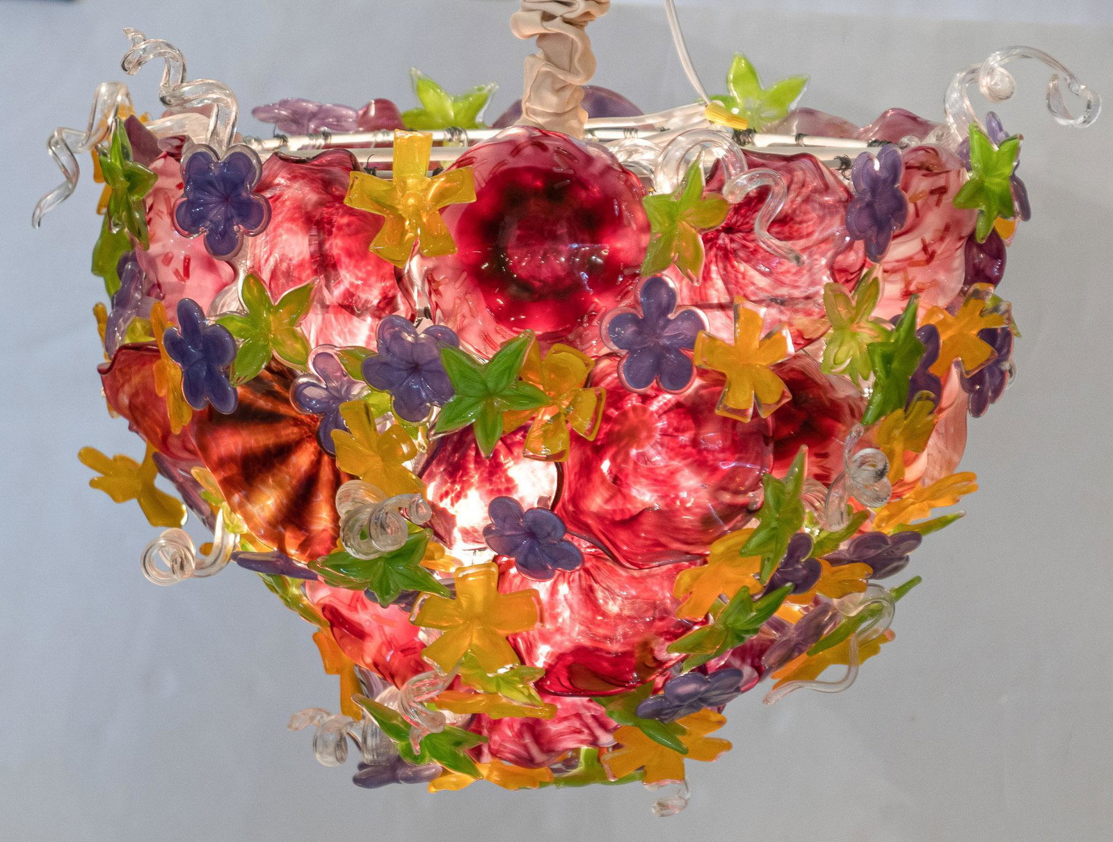 Exceptional Garcia Art Glass Chandelier: Exceptional hand blown Garcia Art Glass (San Antonio, TX) chandelier, having freeform floral motif with many textured and colorful accents, in working condition 21"h x 31"d Condition: Minor ch